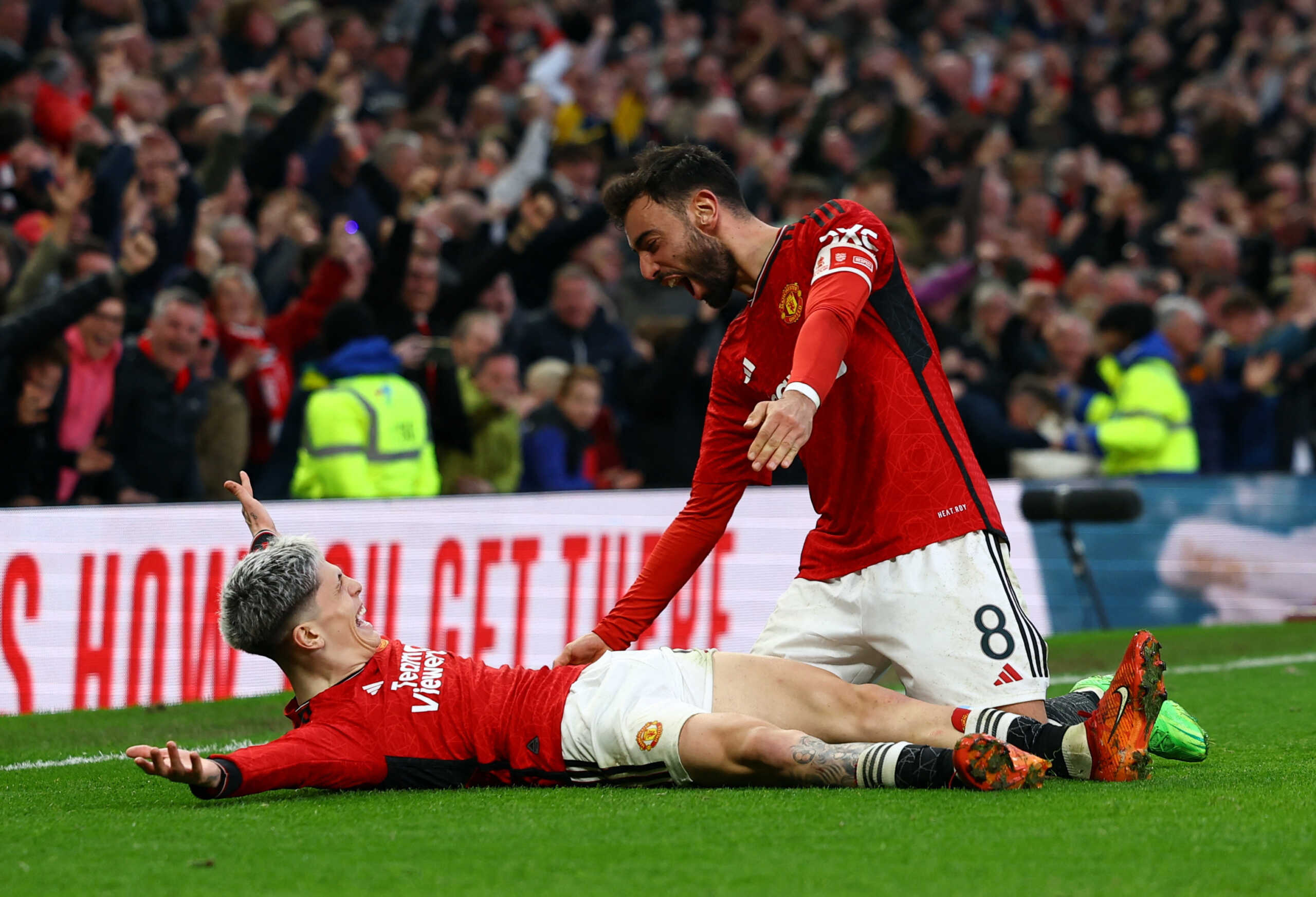 Soccer Football - FA Cup - Quarter Final - Manchester United v Liverpool - Old Trafford, Manchester, Britain - March 17, 2024 Manchester United's Alejandro Garnacho and Bruno Fernandes celebrate after Amad Diallo scores their fourth goal REUTERS
