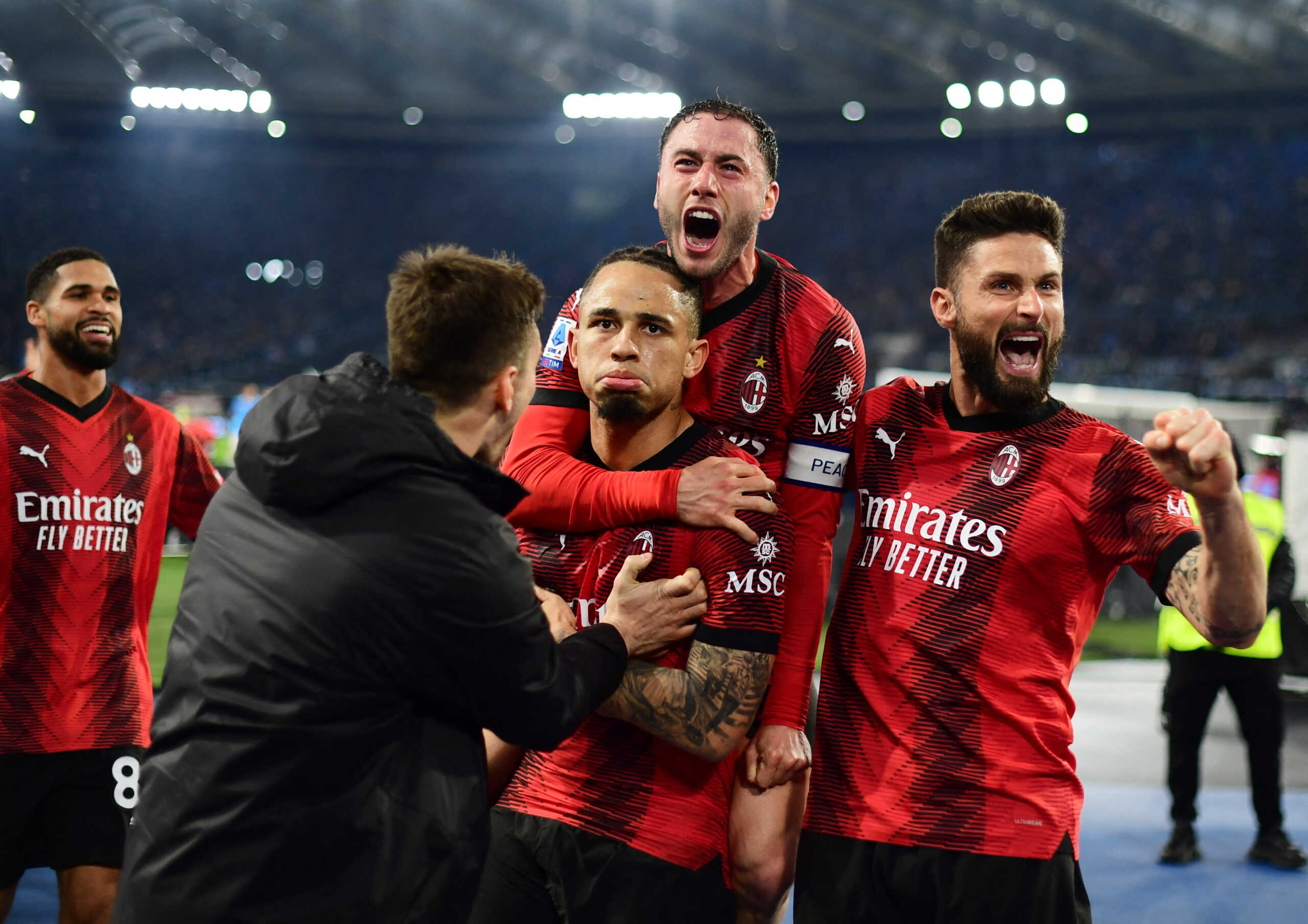 Soccer Football - Serie A - Lazio v AC Milan - Stadio Olimpico, Rome, Italy - March 1, 2024 AC Milan's Noah Okafor celebrates scoring their first goal with teammates REUTERS