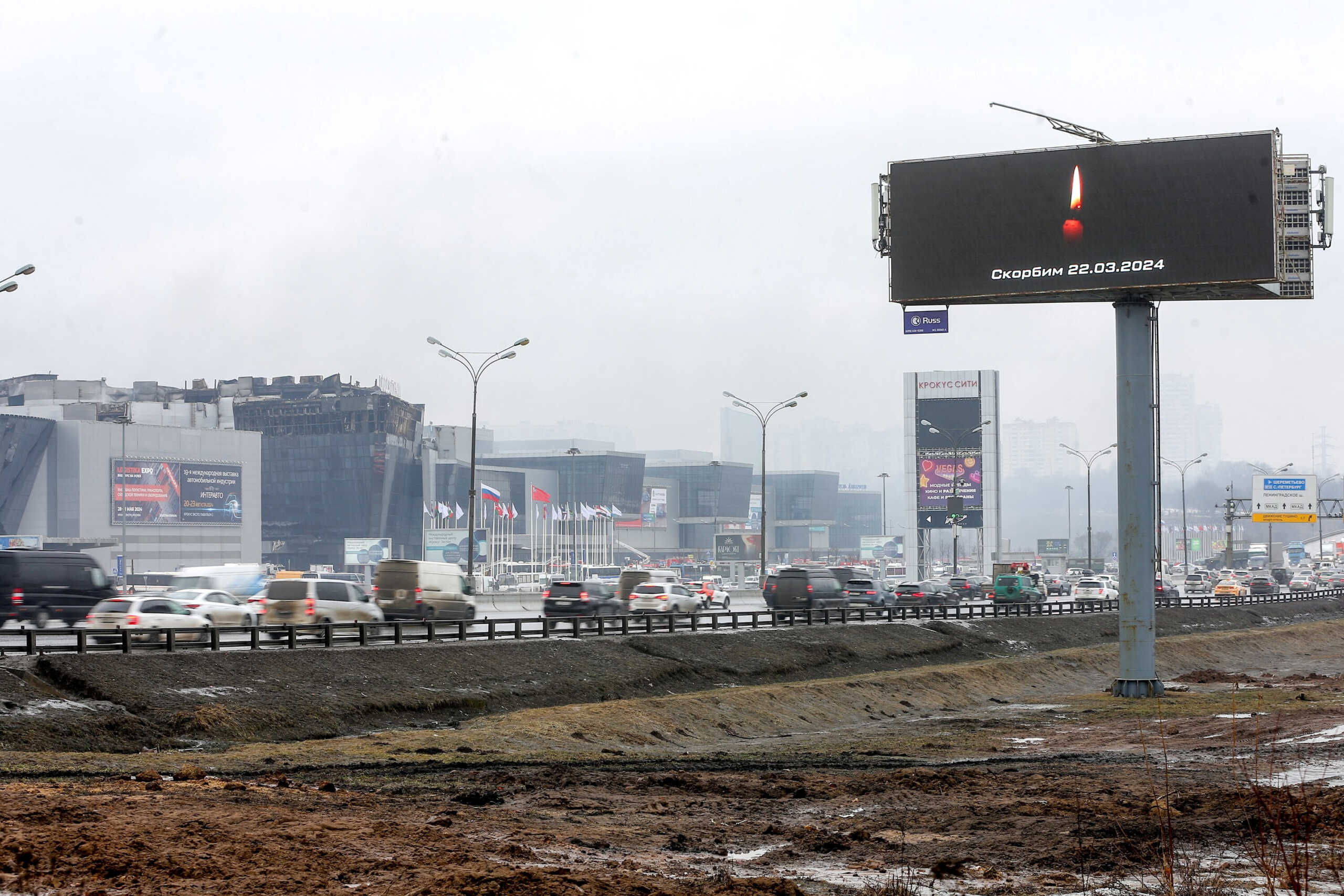 A digital board with a date and a slogan, that reads "We mourn" displayed in memory of victims of the shooting incident, is seen opposite the Crocus City Hall concert venue, outside Moscow, Russia, March 23, 2024.  Sergei Vedyashkin