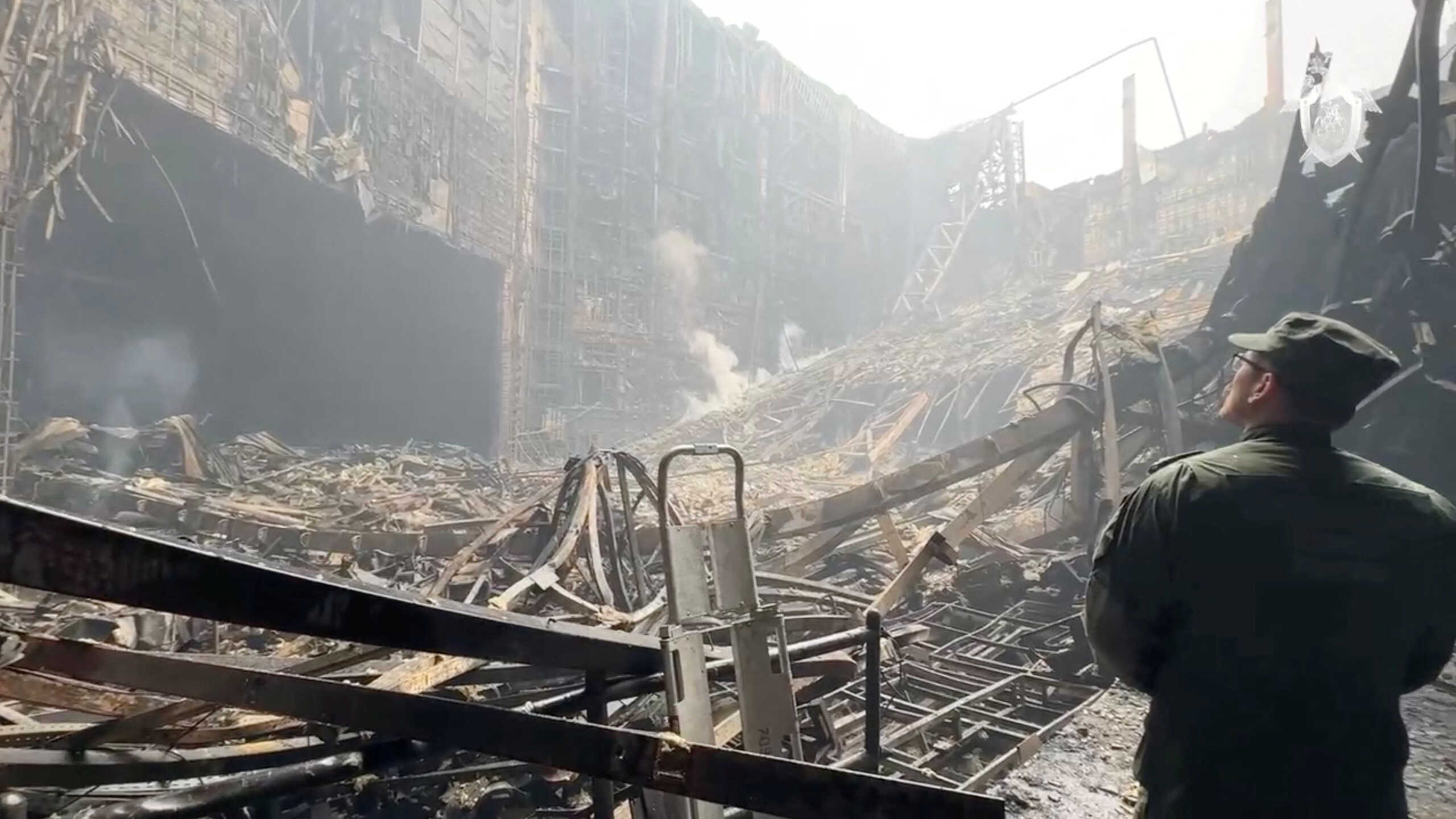 A member of the Investigative Committee of Russia works at the scene of the deadly shooting attack in Crocus City Hall concert venue, in the Moscow Region, Russia March 23, 2024, in this still image taken from a handout video. Russian Investigative Committee