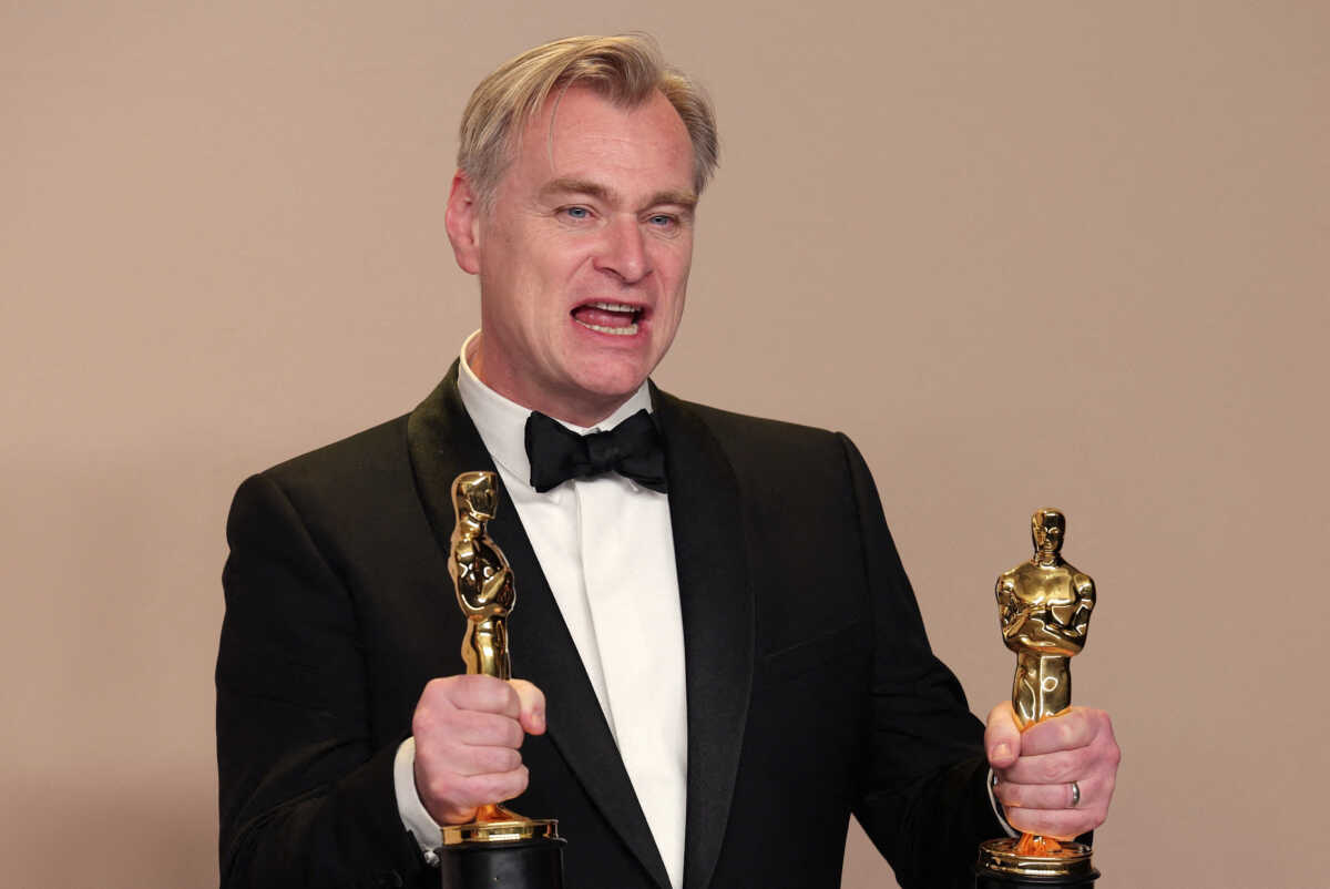 Christopher Nolan poses with the Oscar for Best Picture and Best Director Oscar for "Oppenheimer", in the Oscars photo room at the 96th Academy Awards in Hollywood, Los Angeles, California, U.S., March 10, 2024. REUTERS