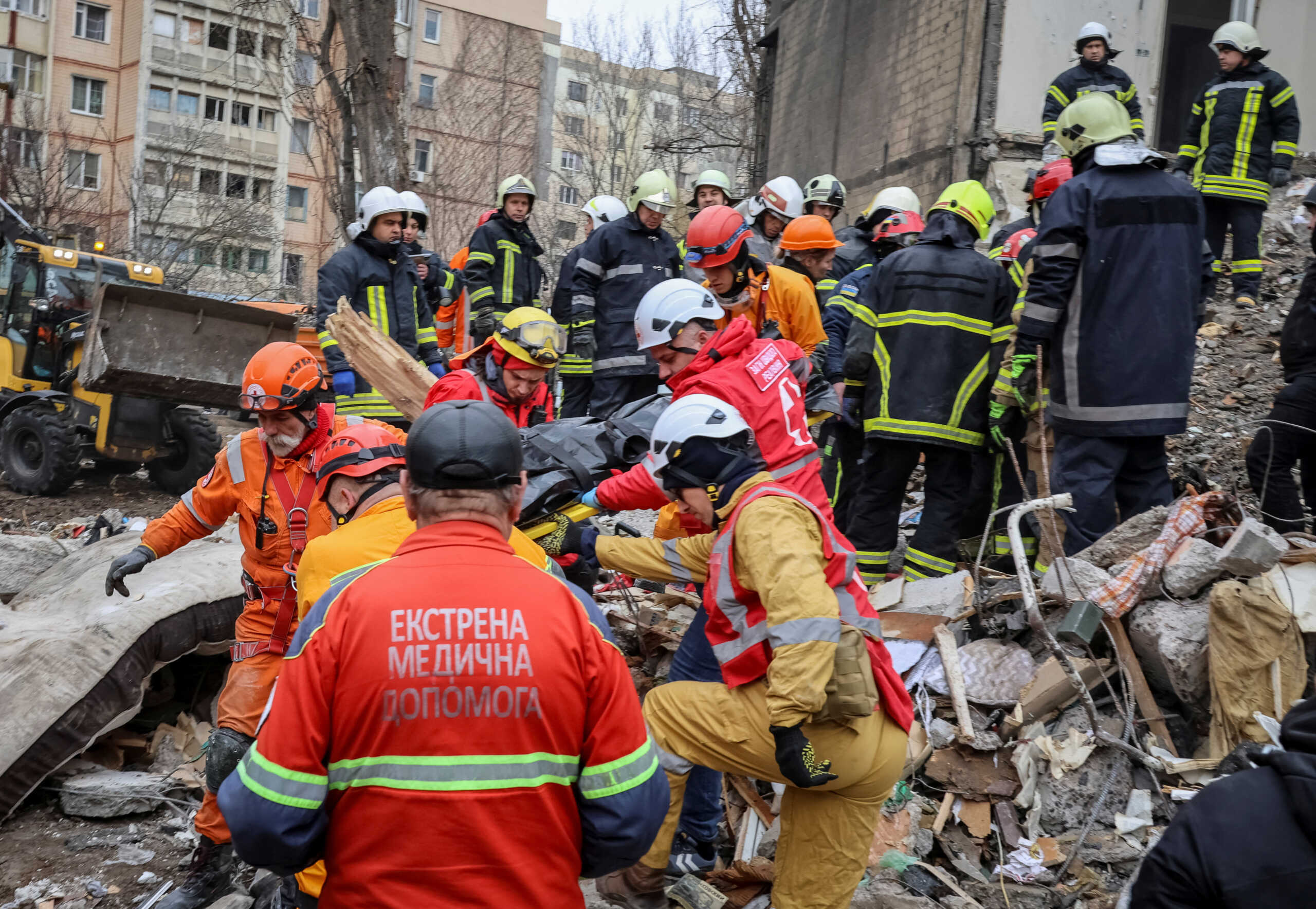 Rescuers remove the body of a local resident at the site of a residential building heavily damaged by a Russian drone strike, amid Russia's attack on Ukraine, in Odesa, Ukraine March 2, 2024. REUTERS