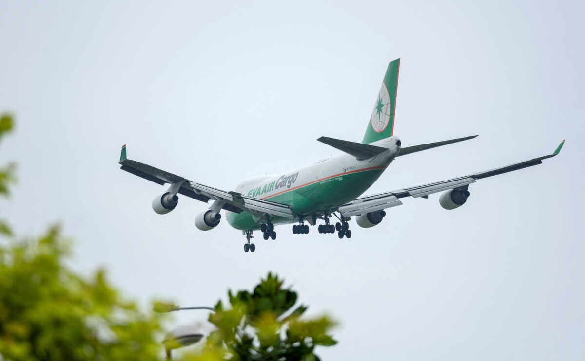 FILE PHOTO: An Eva Air Cargo Boeing 747-400F freighter airplane approaches to land at Changi International Airport in Singapore June 10, 2018.  REUTERS