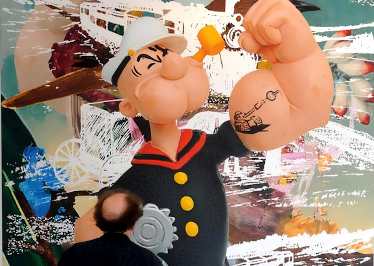 epa01779103 A visitor to the Serpentine Gallery looks over US artist Jeff Koons' 'Popeye Train (Birds)', 2009 in London, Britain, 30 June 2009. Koons is exhibiting his Popeye Series of which he began in 2002. The works incorporates some of Koons' signature ideas and motifs, including surreal combinations of everyday objects, cartoon imagery, art-historical references and children's toys. It is the first ever major survey of Koons' work seen in England.  EPA