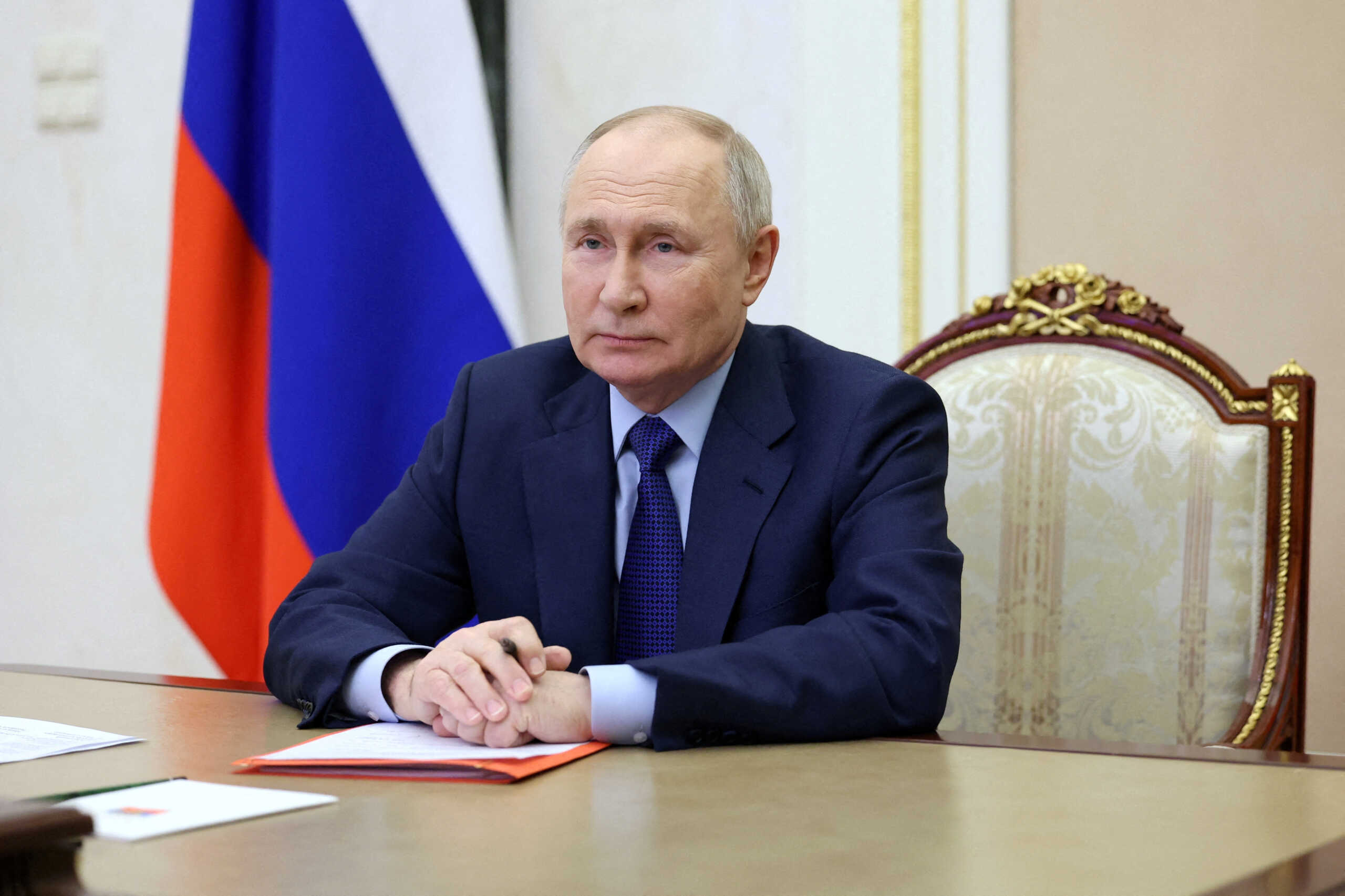 FILE PHOTO: Russian President Vladimir Putin chairs a meeting with members of the Security Council via video link at the Kremlin in Moscow, Russia February 9, 2024. Sputnik