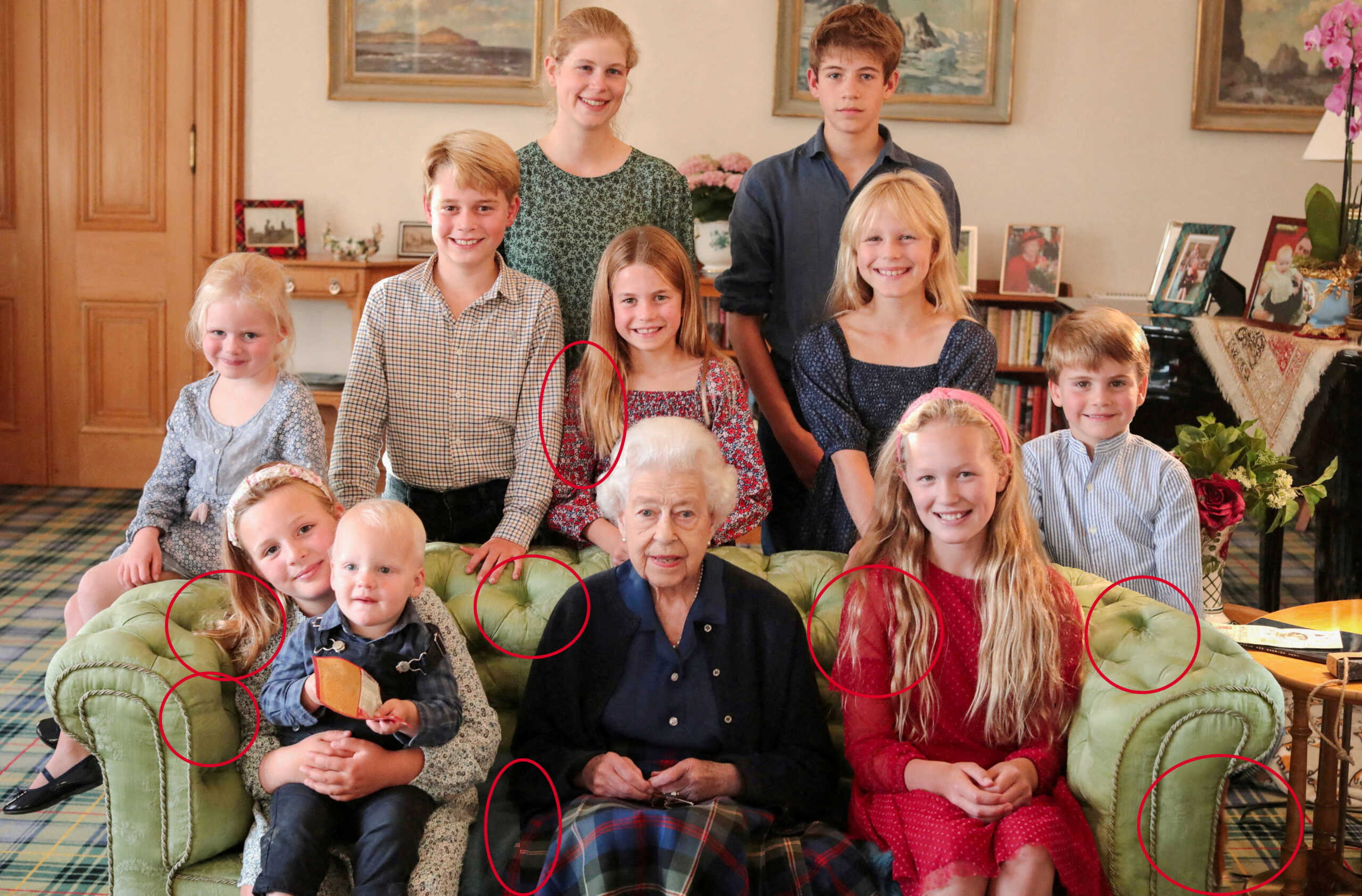A family portrait of Britain's late Queen Elizabeth II with some of her grandchildren and great grandchildren (back row, left to right) Lady Louise Mountbatten-Windsor, James, Earl of Wessex, (middle row, left to right) Lena Tindall, Prince George, Princess Charlotte, Isla Phillips, Prince Louis, (front row, left to right) Mia Tindall holding Lucas Tindall, and Savannah Phillips, taken at Balmoral Castle, Britain, in this undated handout image issued by Kensington Palace on April 21, 2023, with indications by Reuters of areas which appear to have been digitally altered by the source. The Prince and Princess of Wales