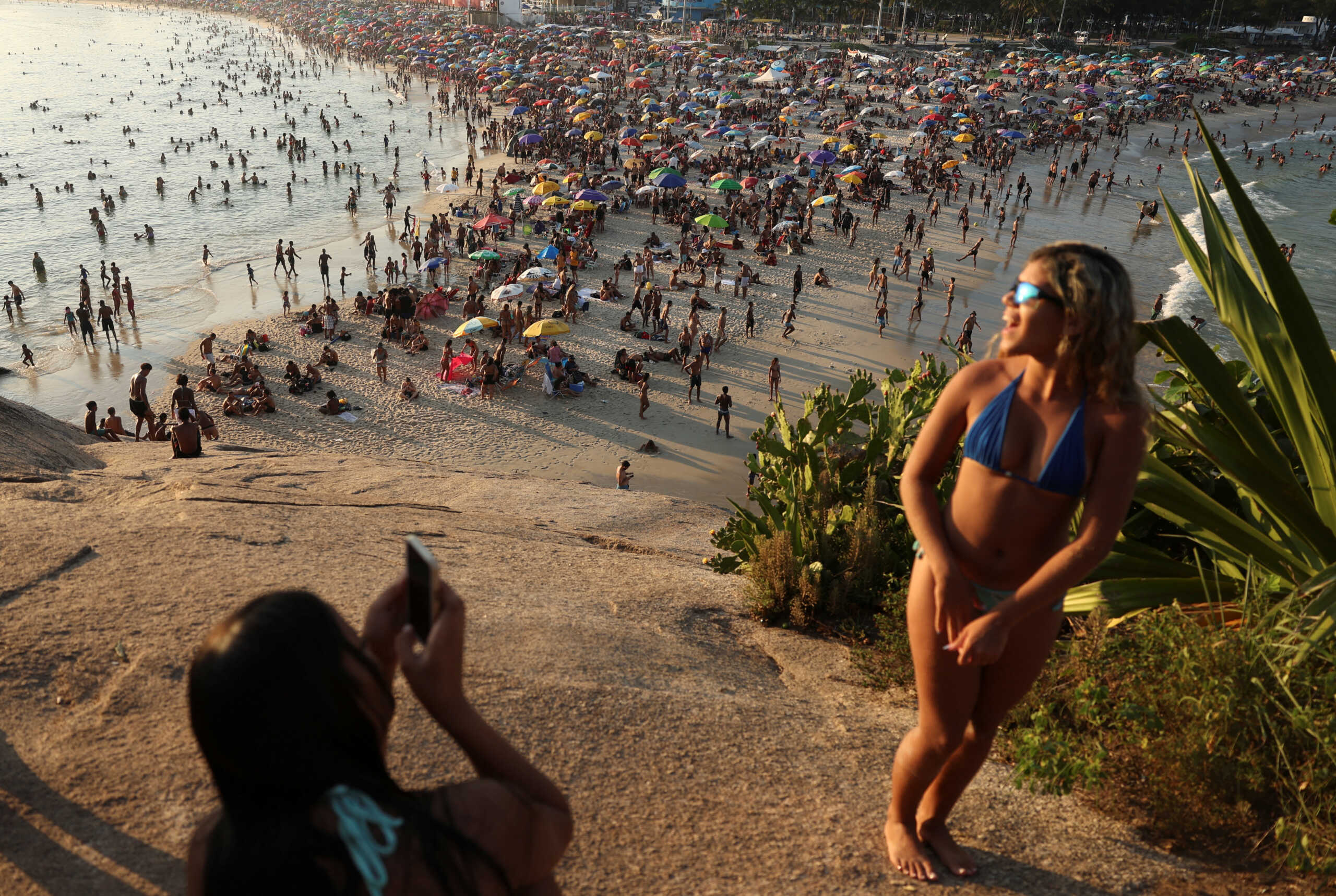 People enjoy the Macumba beach, during a heatwave in Rio de Janeiro, Brazil, March 17, 2024. REUTERS