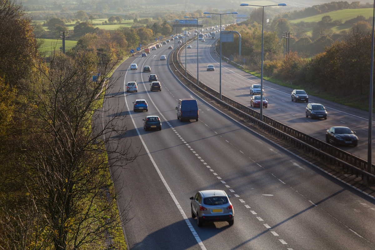 winter sun on sunday motorway traffic Essex England