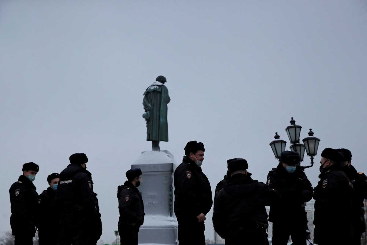 FILE PHOTO: Police officers gather next to a monument to Russian poet Alexander Pushkin as supporters of Russian opposition leader Alexei Navalny are expected to protest against his arrest in Moscow, Russia January 23, 2021. REUTERS