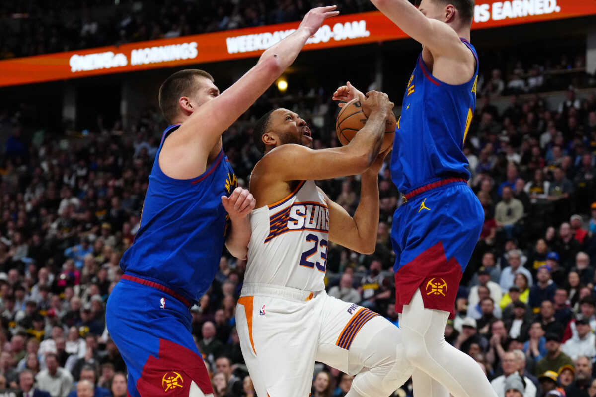 Mar 5, 2024; Denver, Colorado, USA; Denver Nuggets center Nikola Jokic (15) and guard Christian Braun (0) defend Phoenix Suns guard Eric Gordon (23) in the second half at Ball Arena. Mandatory Credit: Ron Chenoy-USA TODAY Sports