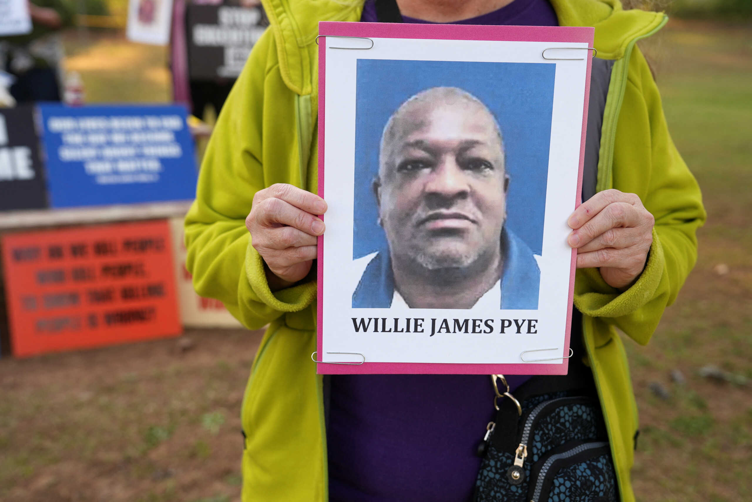 Cathy Harmon-Christian, the executive director of 'Georgians for Alternatives to the Death Penalty', holds a photo of Willie James Pye outside of the Georgia Diagnostic Prison in Jackson, Georgia, U.S. March 20, 2024. REUTERS