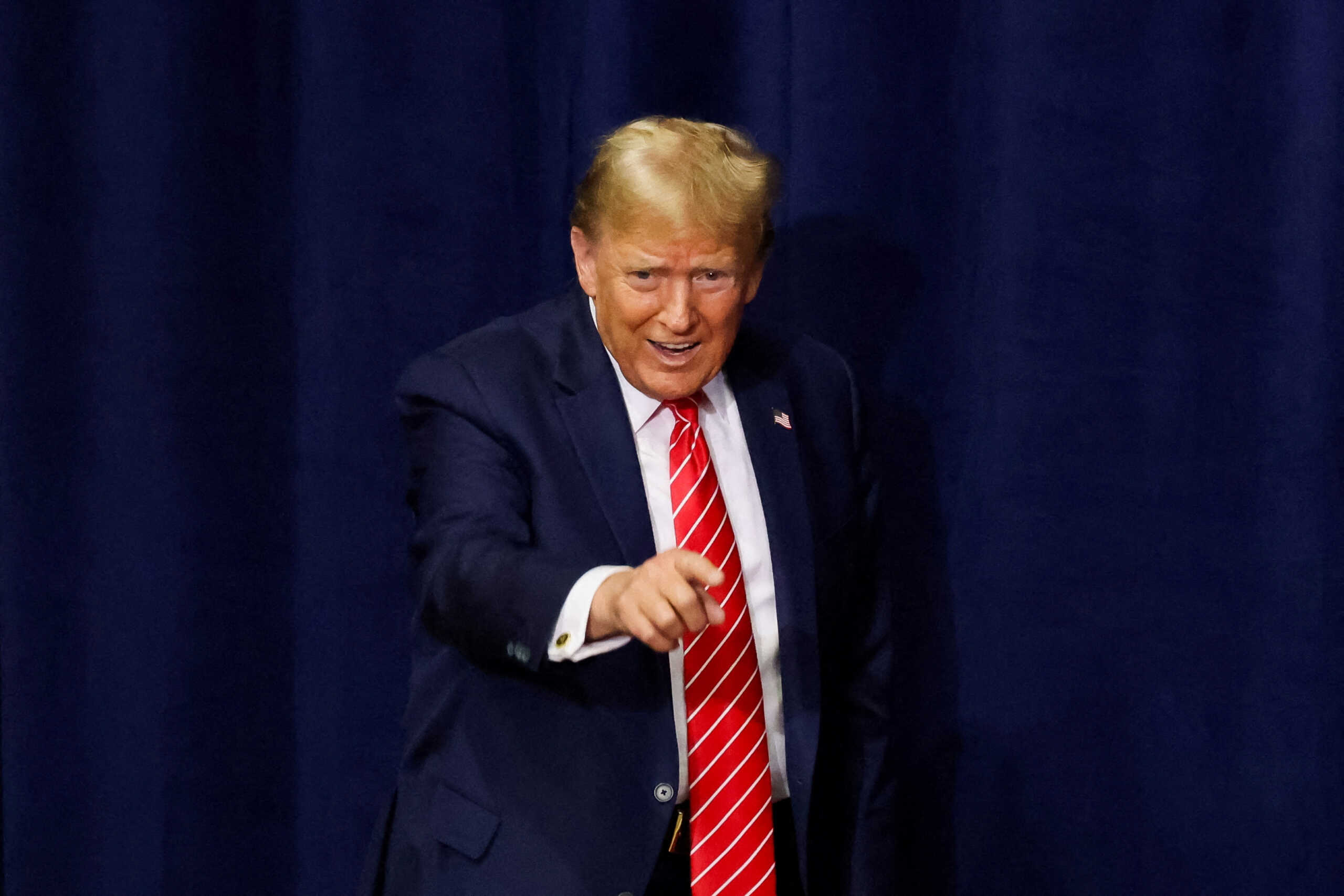 FILE PHOTO: Republican presidential candidate and former U.S. President Donald Trump gestures to supporters as he hosts a campaign rally at the Forum River Center in Rome, Georgia, U.S. March 9, 2024. REUTERS