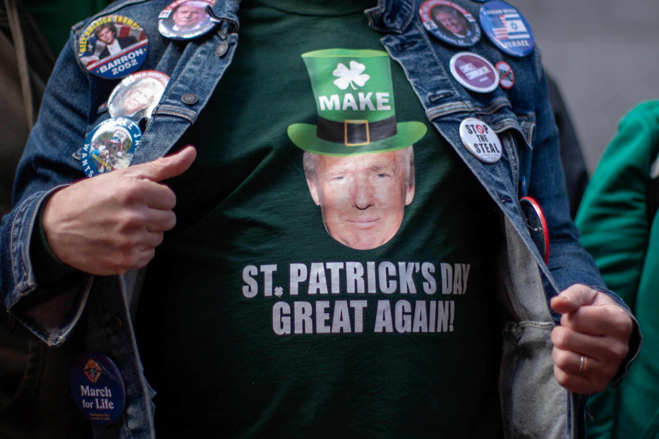 A man wears a t-shirt depicting the face of former U.S. President Donald Trump as he attends the annual Saint Patrick's Day Parade on 5th Avenue in Manhattan, New York City, U.S., March 16, 2024  REUTERS