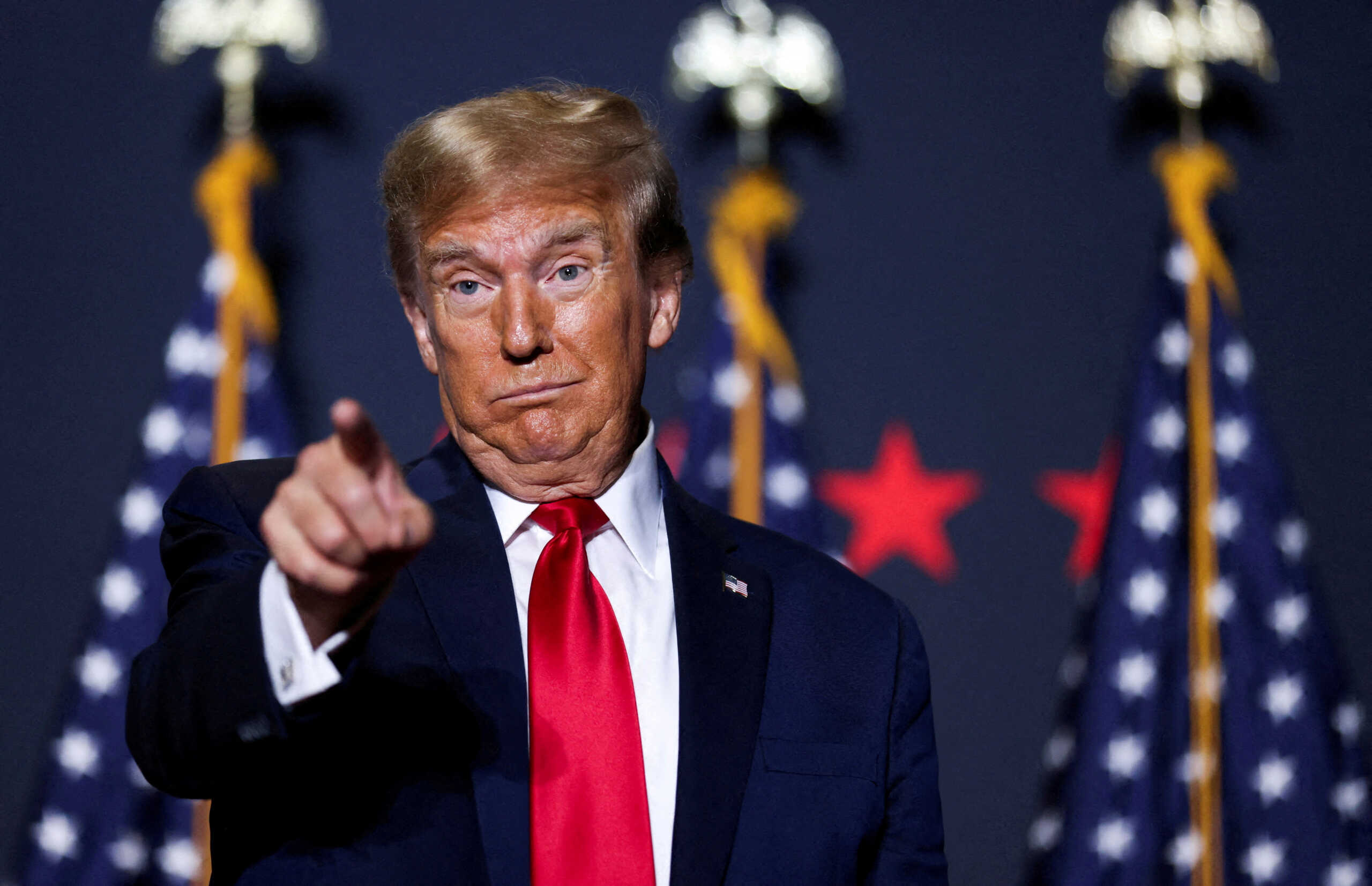 FILE PHOTO: Republican presidential candidate and former U.S. President Donald Trump gestures at a campaign event ahead of the Republican presidential primary election in North Charleston, South Carolina, U.S. February 14, 2024. REUTERS