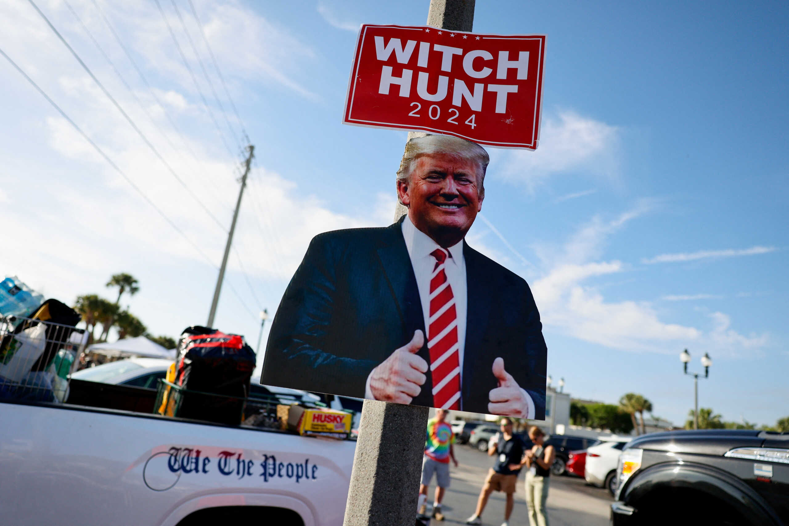 A cutout of Republican presidential candidate and former U.S. President Donald Trump is seen as his supporters gather outside the courthouse as Trump is expected to bid for dismissal in a hearing on a classified documents case, in Fort Pierce, Florida, U.S. March 14, 2024. REUTERS