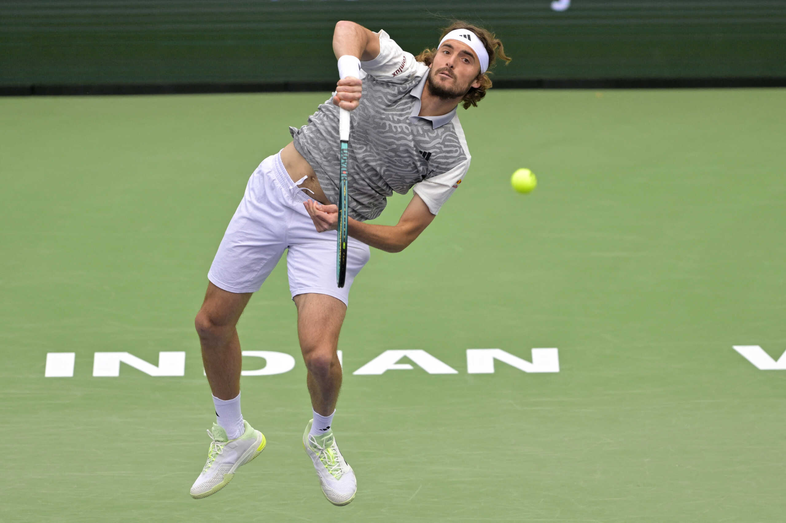 Mar 12, 2024; Indian Wells, CA, USA; Stefanos Tsitsipas (GRE) hits a shot in his fourth round match against Jiri Lehecka (CZE) in the BNP Paribas Open at the Indian Wells Tennis Garden. Mandatory Credit: Jayne Kamin-Oncea-USA TODAY Sports