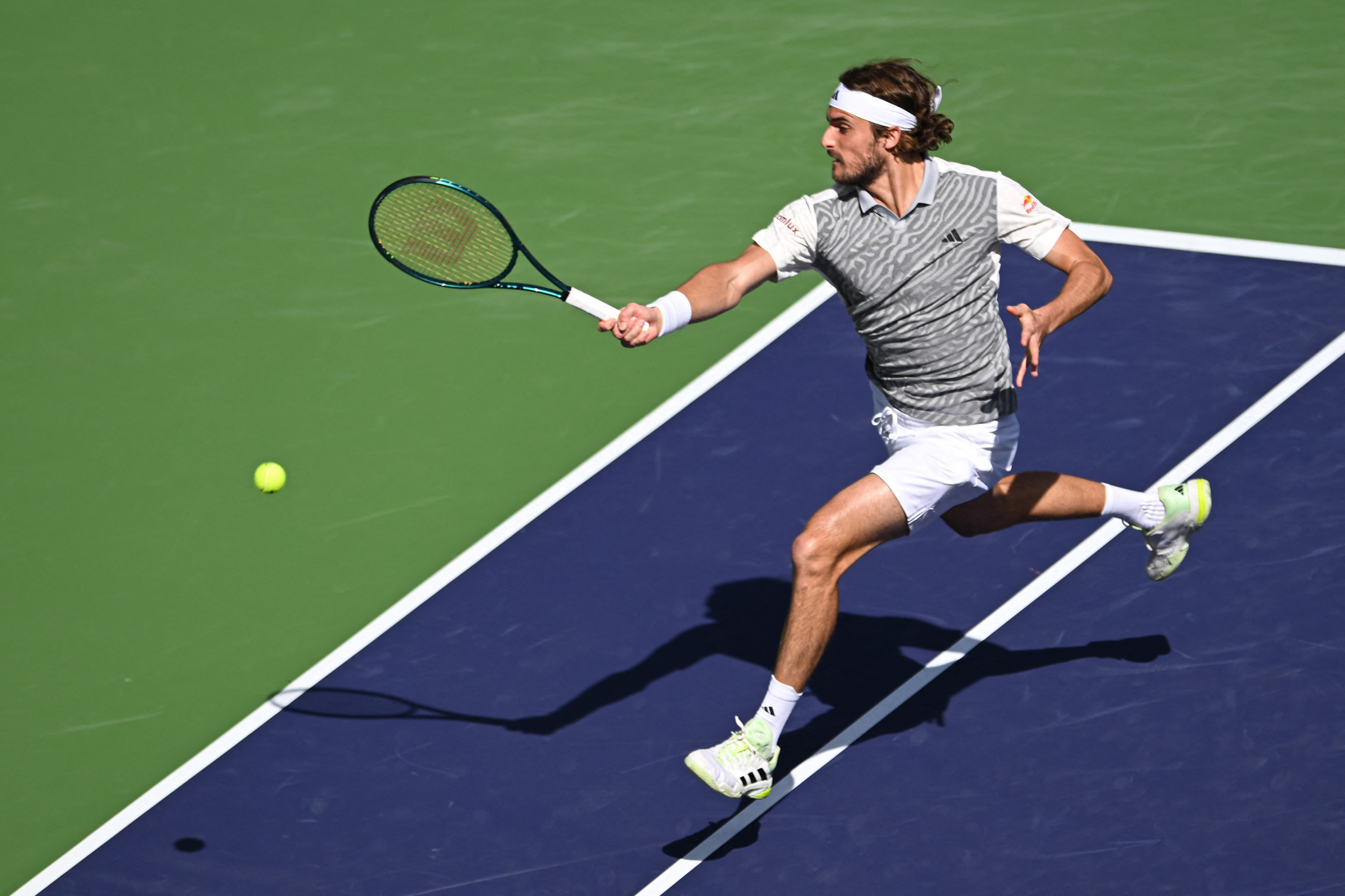 Mar 10, 2024; Indian Wells, CA, USA; Stefanos Tsitsipas (GRE) hits a shot in his third round match against Frances Tiafoe (USA) during the BNP Paribas Open at Indian Wells Tennis Garden. Mandatory Credit: Jonathan Hui-USA TODAY Sports