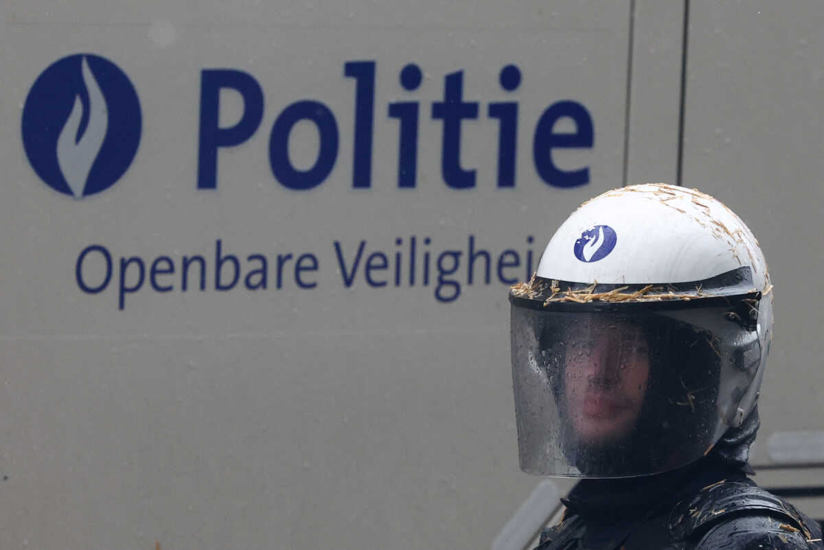 A police officer looks on during a protest of European farmers over price pressures, taxes and green regulation, on the day of an EU Agriculture Ministers meeting in Brussels, Belgium February 26, 2024. REUTERS
