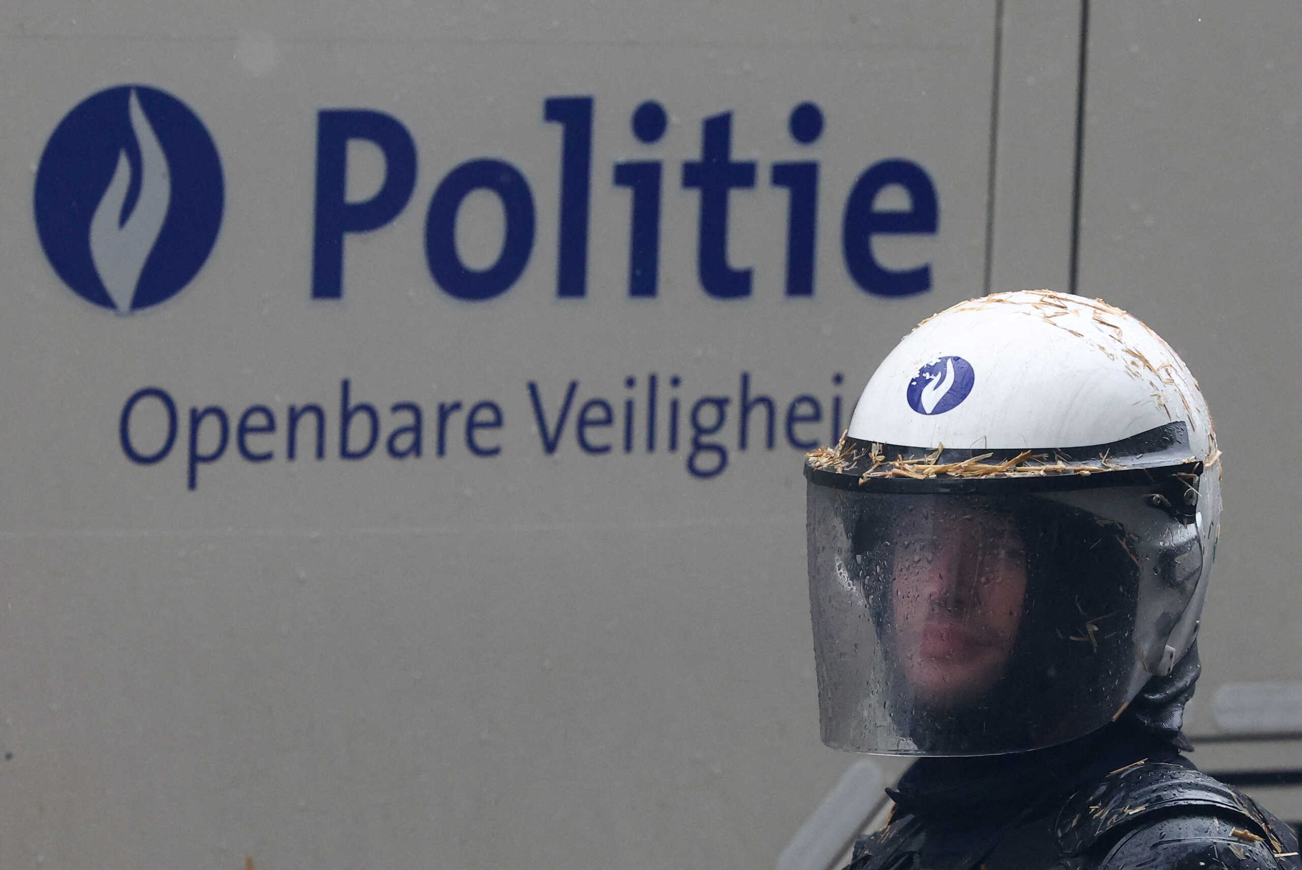 A police officer looks on during a protest of European farmers over price pressures, taxes and green regulation, on the day of an EU Agriculture Ministers meeting in Brussels, Belgium February 26, 2024. REUTERS