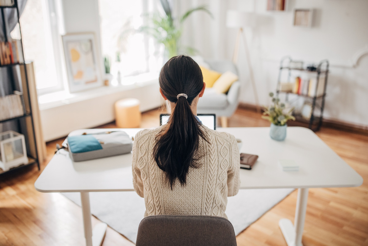 One woman, Japanese woman working on laptop in her home office.