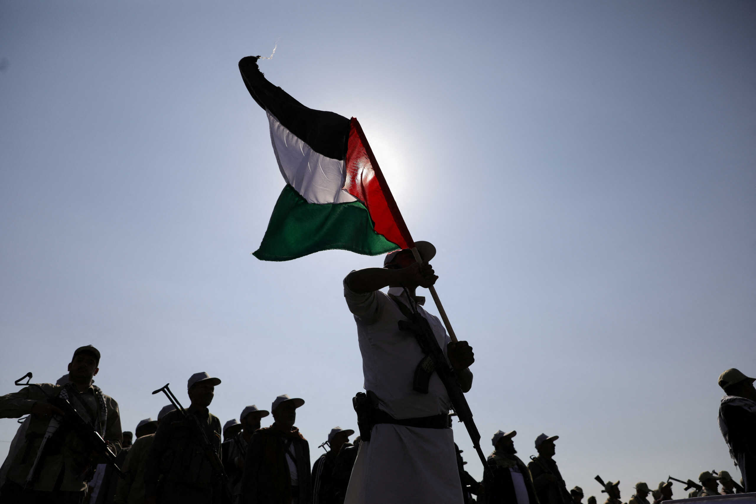 State servants parade following 12 days of military training they have received as part of a mobilization campaign by the Houthis in Sanaa, Yemen March 9, 2024. REUTERS