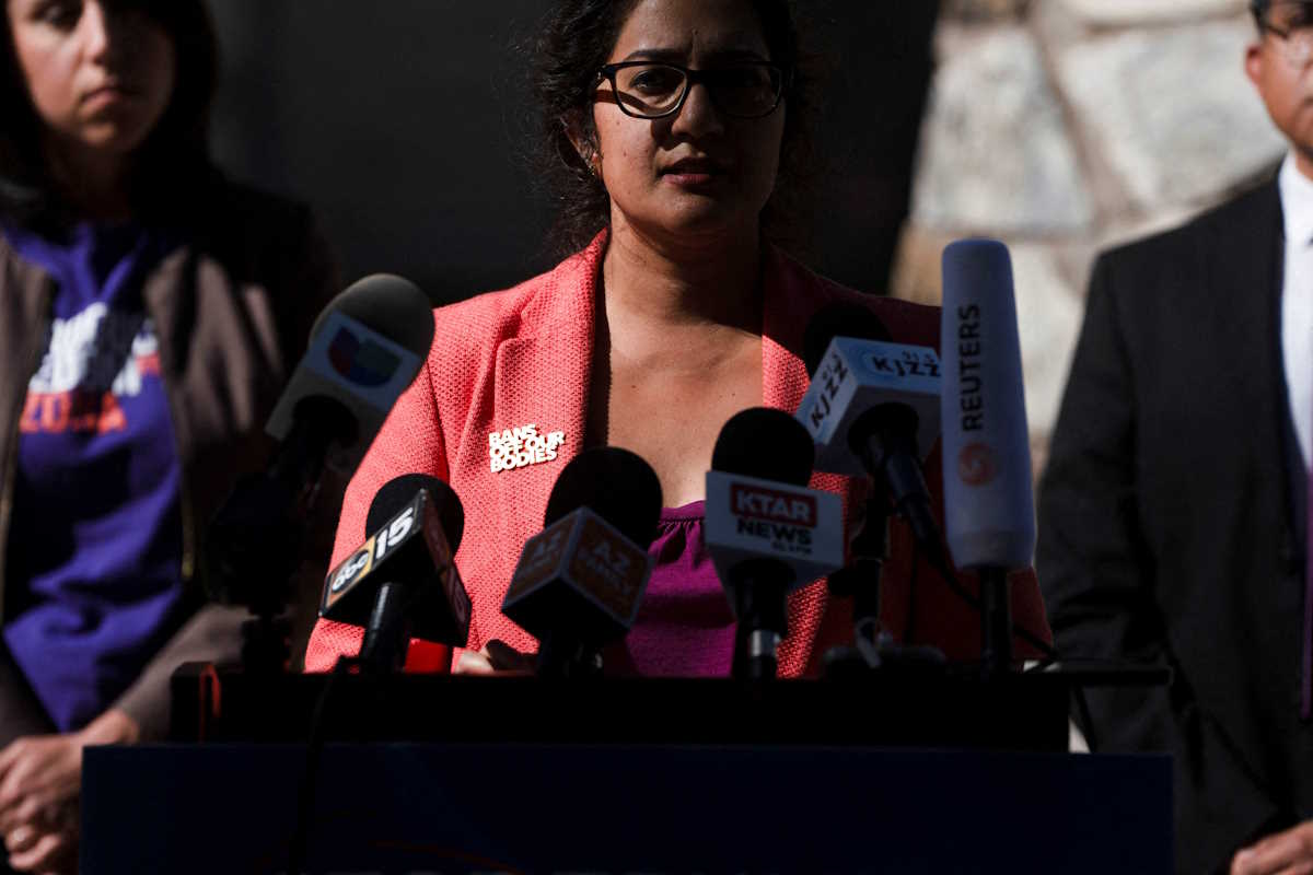 Democrat Arizona State Sen. Priya Sundareshan wears a pin that reads “bans off our bodies” during a press conference with the Biden for Arizona campaign before the Arizona House Democrats in the Arizona State Legislature try again to repeal an 1864 law that bans nearly all abortions, during a session in the state legislature in Phoenix, Arizona, U.S. April 24, 2024. REUTERS