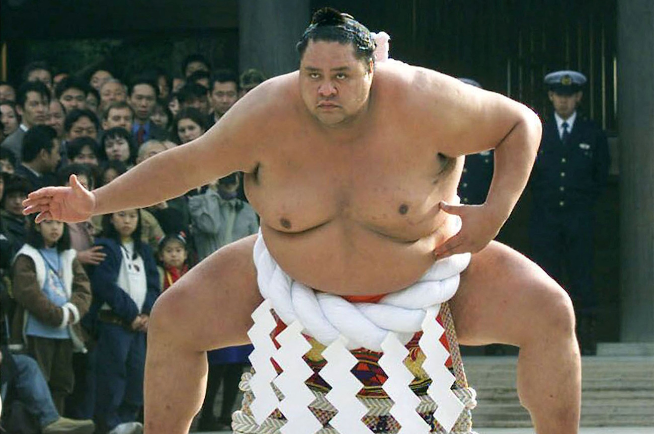 FILE PHOTO: Hawaiian-born sumo wrestler Akebono, Japan's first foreign-born yokozuna or sumo grand champion, seen performing a sacred ring-entering ritual at Tokyo's Meiji Shrine. Picture taken Jan  6, 2000.