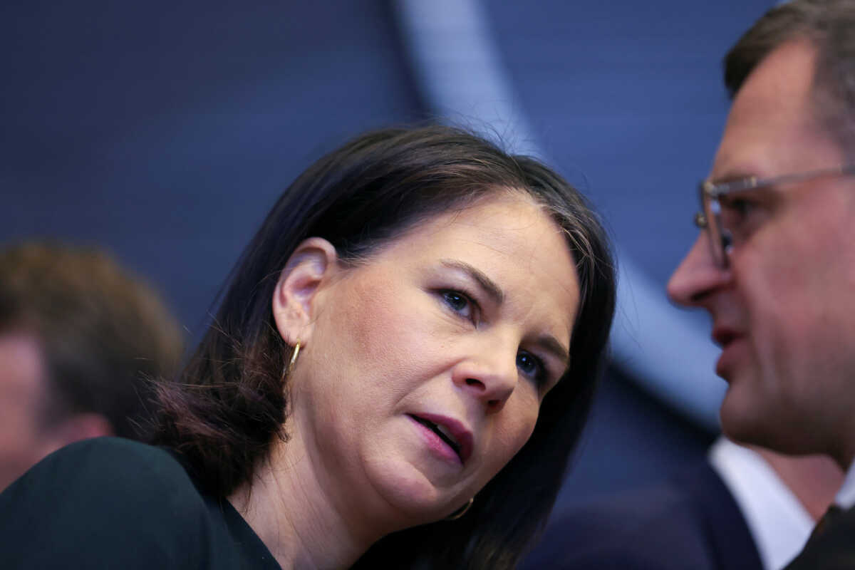 Ukraine's Foreign Minister Dmytro Kuleba speaks with Germany's Foreign Minister Annalena Baerbock, as they take part in a meeting of the NATO-Ukraine Council in the Foreign Ministers' session at the Alliance's headquarters in Brussels, Belgium April 4, 2024. REUTERS
