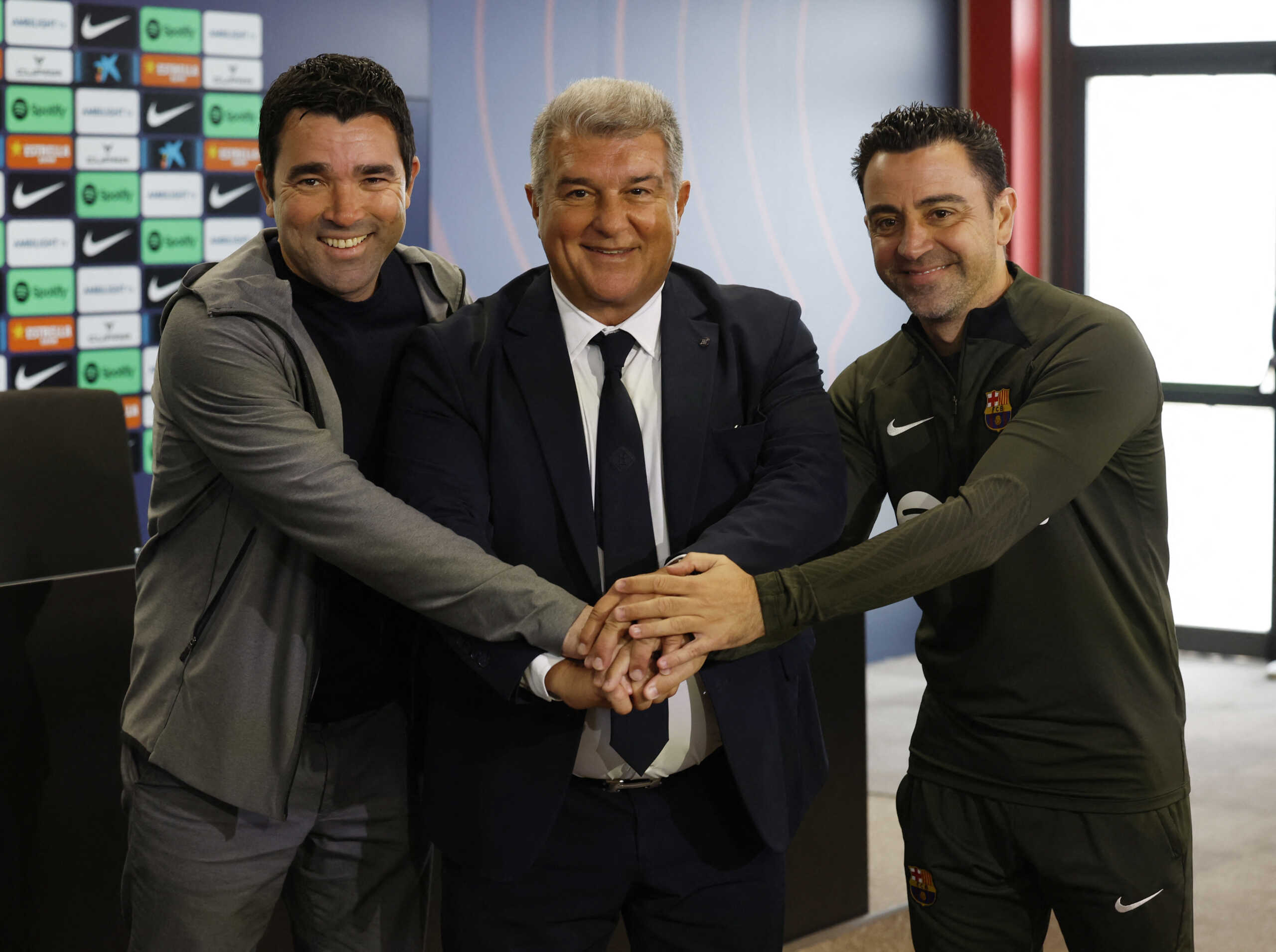Soccer Football - FC Barcelona Press Conference - Ciutat Esportiva Joan Gamper, Barcelona, Spain - April 25, 2024 FC Barcelona coach Xavi, sporting director Deco and president Joan Laporta pose during a press conference REUTERS