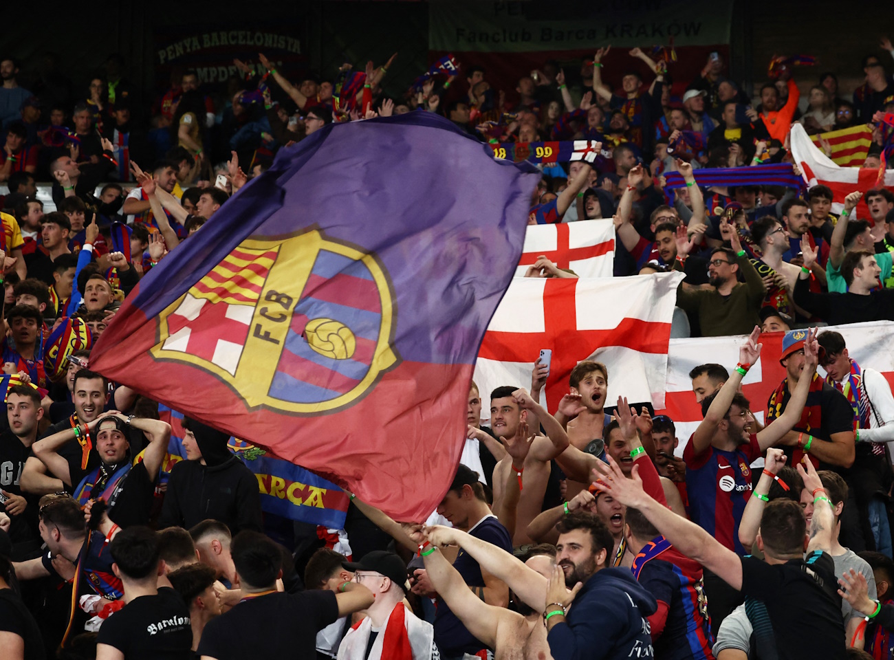 Soccer Football - Champions League - Quarter Final - First Leg - Paris St Germain v FC Barcelona - Parc des Princes, Paris, France - April 10, 2024 FC Barcelona fans celebrate after the match REUTERS