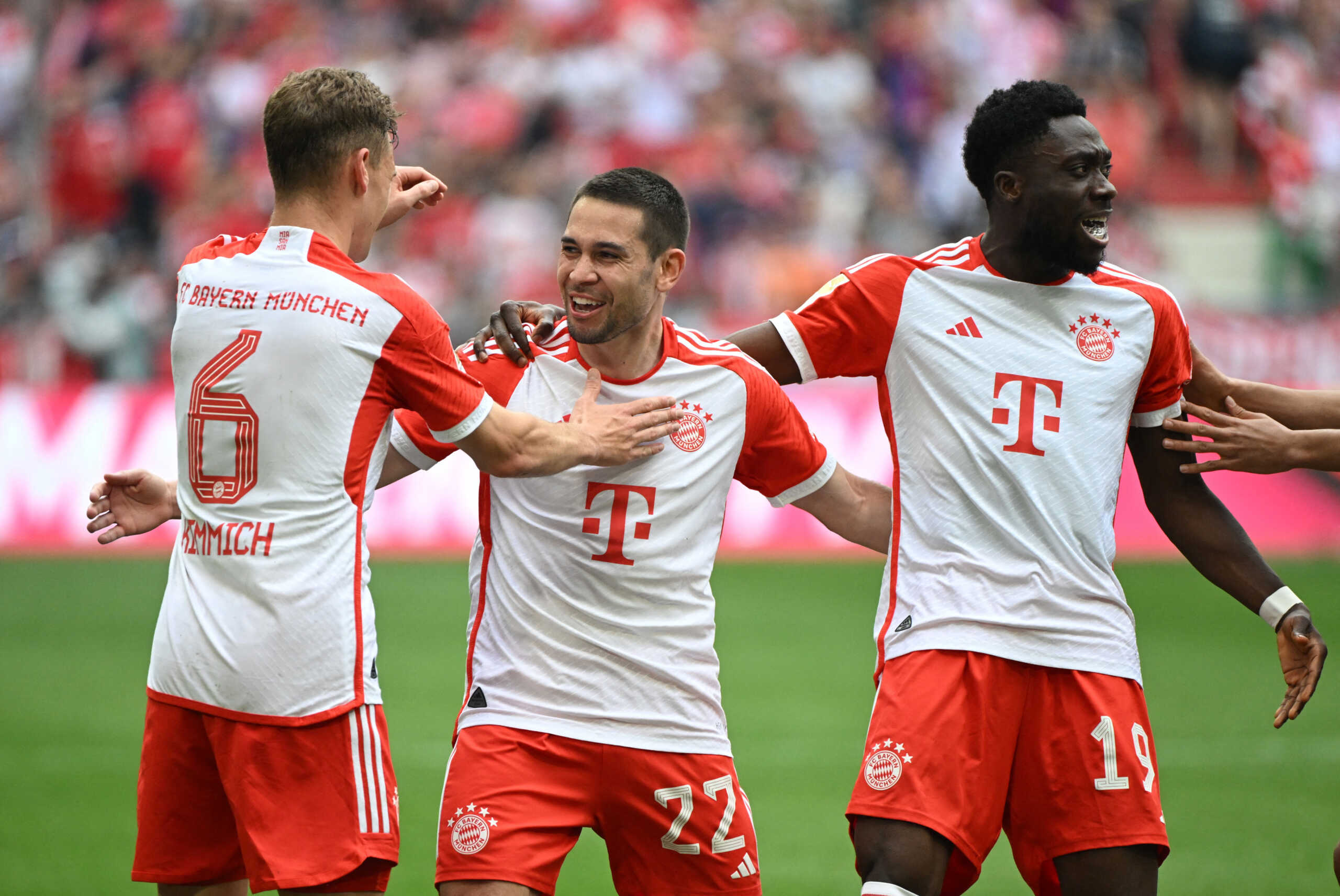 Soccer Football - Bundesliga - Bayern Munich v FC Cologne - Allianz Arena, Munich, Germany - April 13, 2024 Bayern Munich's Raphael Guerreiro celebrates scoring their first goal with Alphonso Davies and Joshua Kimmich REUTERS