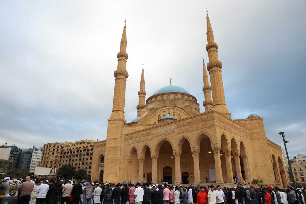 Muslim worshippers attend Eid al-Fitr prayers, marking the end of the holy fasting month of Ramadan, outside Al-Amin mosque in downtown Beirut, Lebanon April 10, 2024. REUTERS