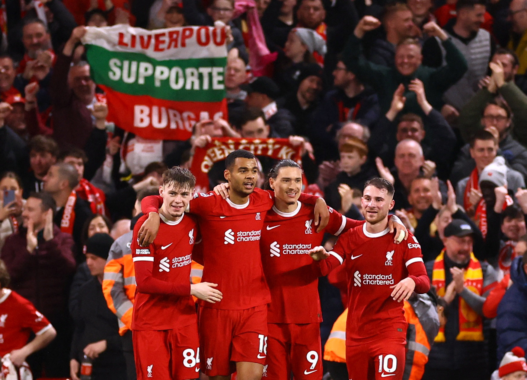 Soccer Football - Premier League - Liverpool v Sheffield United - Anfield, Liverpool, Britain - April 4, 2024 Liverpool's Cody Gakpo celebrates scoring their third goal with teammates REUTERS