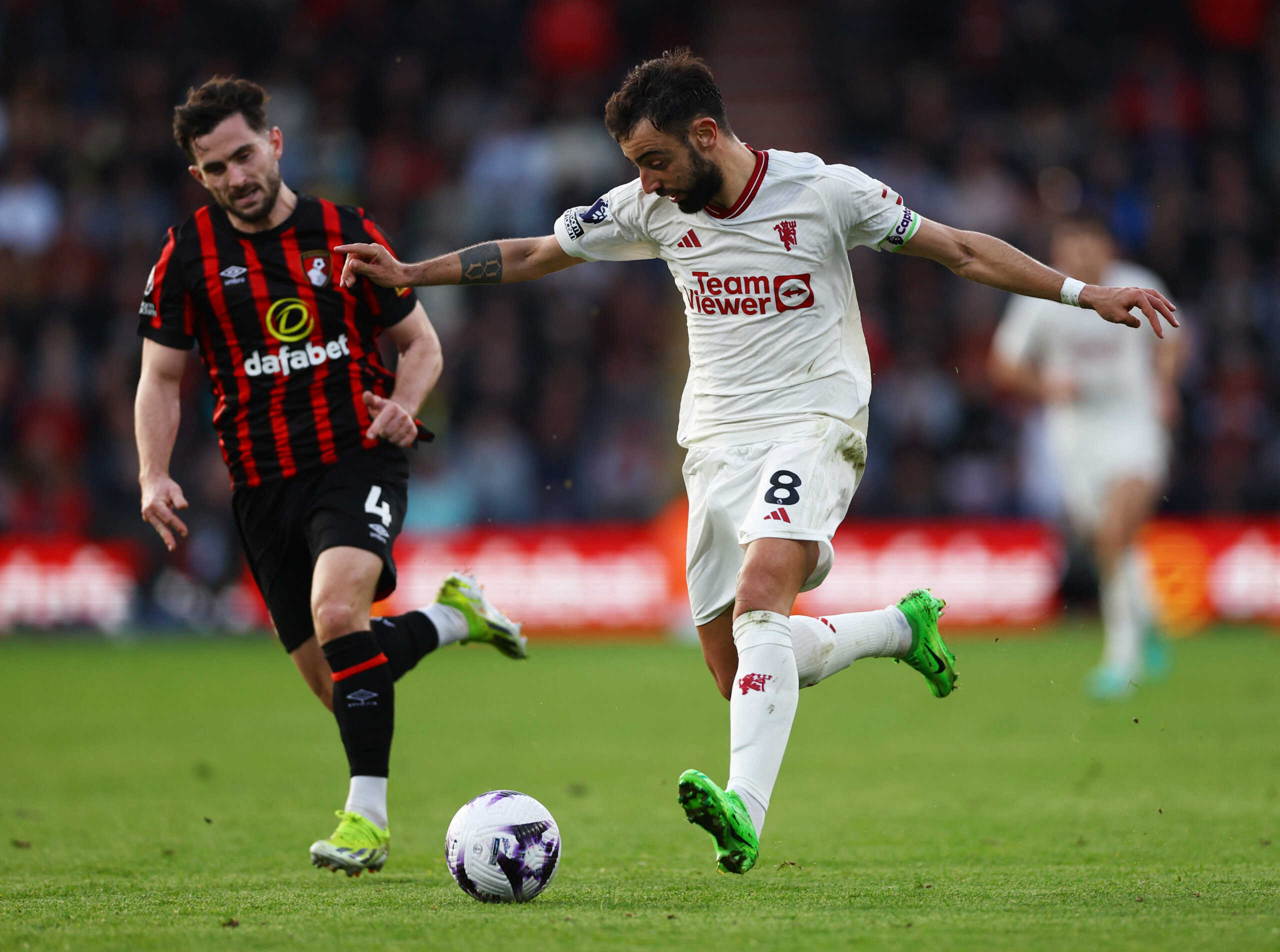 Soccer Football - Premier League - AFC Bournemouth v Manchester United - Vitality Stadium, Bournemouth, Britain - April 13, 2024 Manchester United's Bruno Fernandes in action with AFC Bournemouth's Lewis Cook Action Images via Reuters