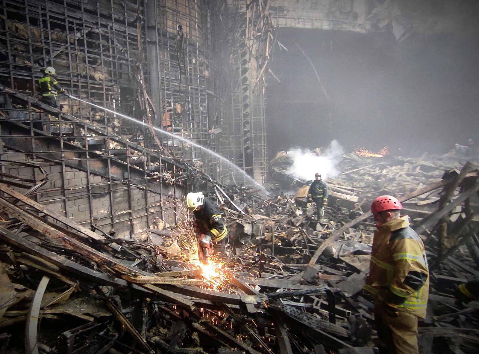 Members of the Russian Emergencies Ministry carry out search and rescue operations at the Crocus City Hall concert venue after a shooting attack and fire, outside Moscow, Russia, in this picture obtained March 24, 2024. PICTURE OBTAINED BY REUTERS