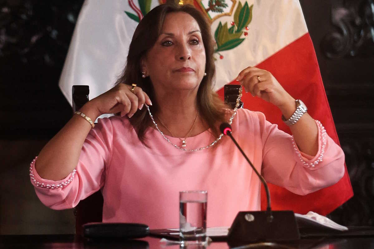 Peru's President Dina Boluarte shows a piece of jewellery during a press conference at the government palace after her statement to the prosecutor's office hearing on an investigation for the possession of expensive jewellery, including Rolex watches and a Cartier bracelet, in Lima, Peru April 5, 2024. REUTERS