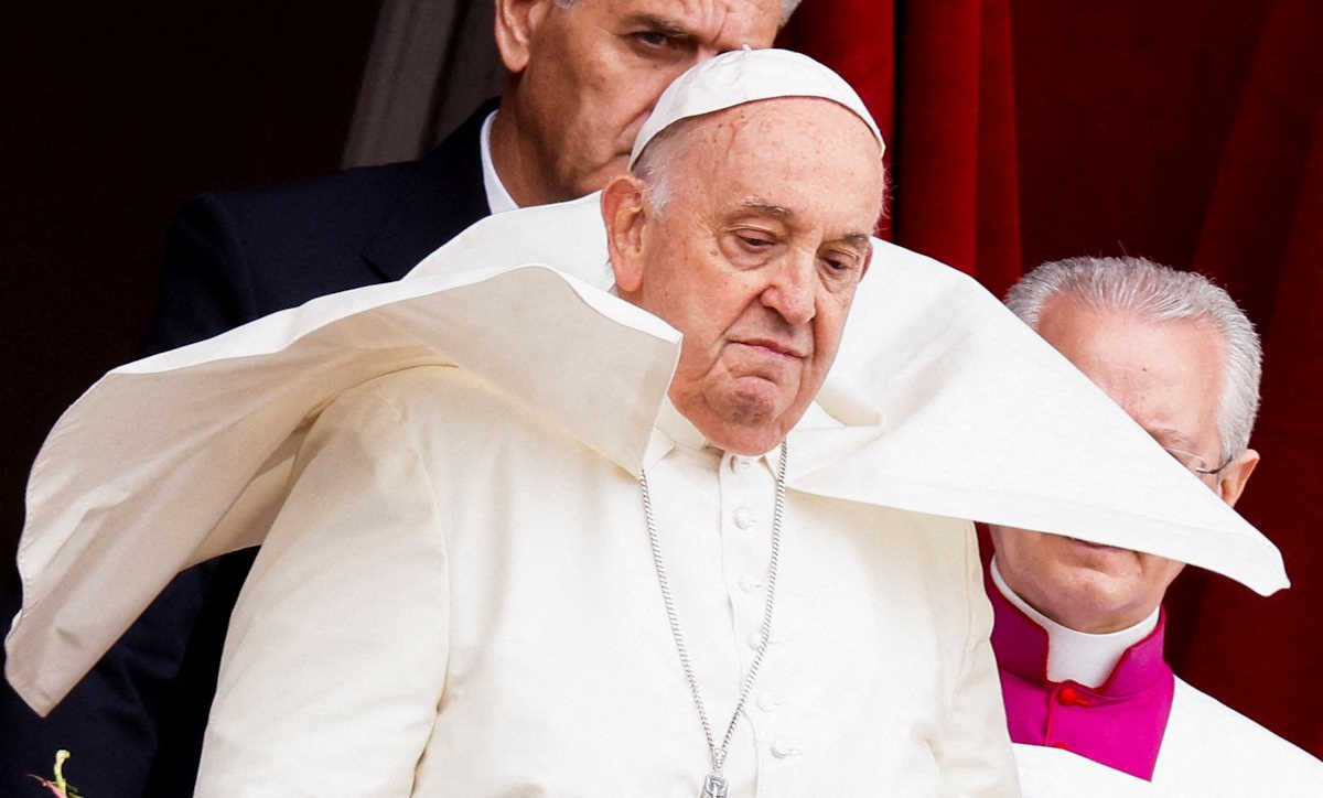 Pope Francis looks on from a balcony at St. Peter's Square, on Easter Sunday, at the Vatican March 31, 2024. REUTERS