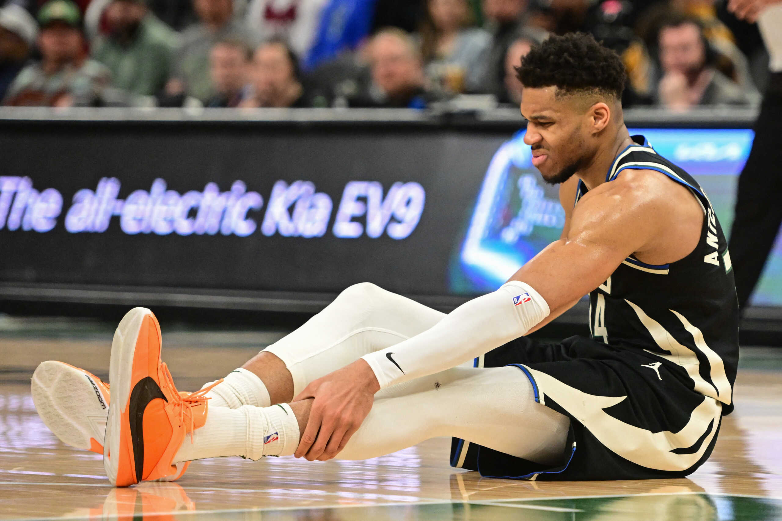 Apr 9, 2024; Milwaukee, Wisconsin, USA; Milwaukee Bucks forward Giannis Antetokounmpo (34) grabs his leg in the third quarter and left game against the Boston Celtics with an injury at Fiserv Forum. Mandatory Credit: Benny Sieu-USA TODAY Sports