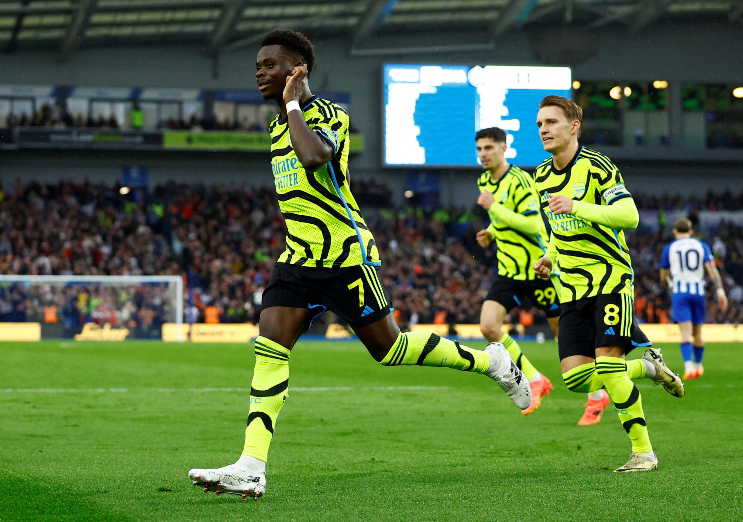 Soccer Football - Premier League - Brighton & Hove Albion v Arsenal - The American Express Community Stadium, Brighton, Britain - April 6, 2024 Arsenal's Bukayo Saka celebrates scoring their first goal Action Images via Reuters