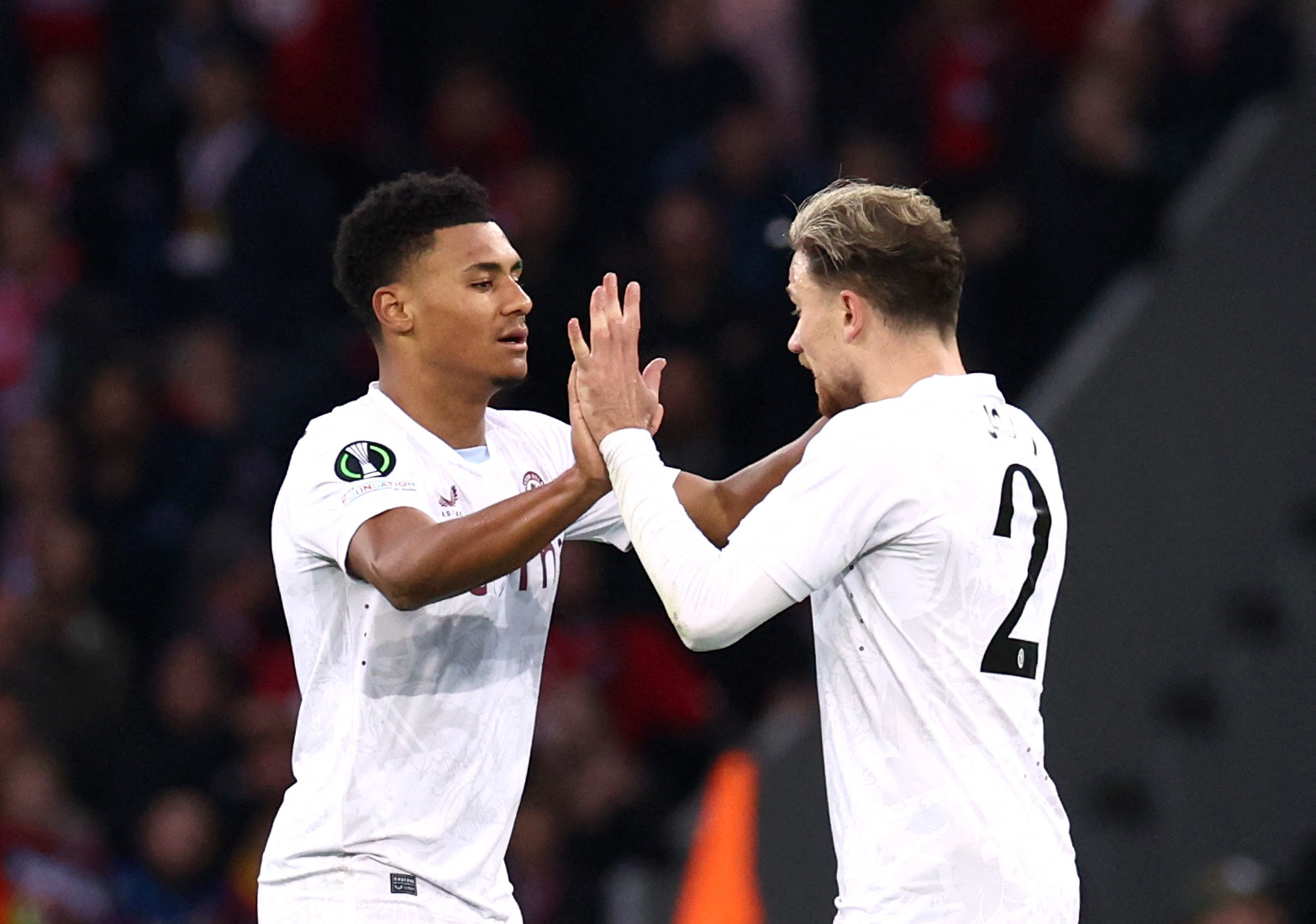 Soccer Football - Europa Conference League - Quarter Final - Second Leg - Lille v Aston Villa - Stade Pierre-Mauroy, Villeneuve-d'Ascq, France - April 18, 2024 Aston Villa's Matty Cash celebrates scoring their first goal with Ollie Watkins REUTERS