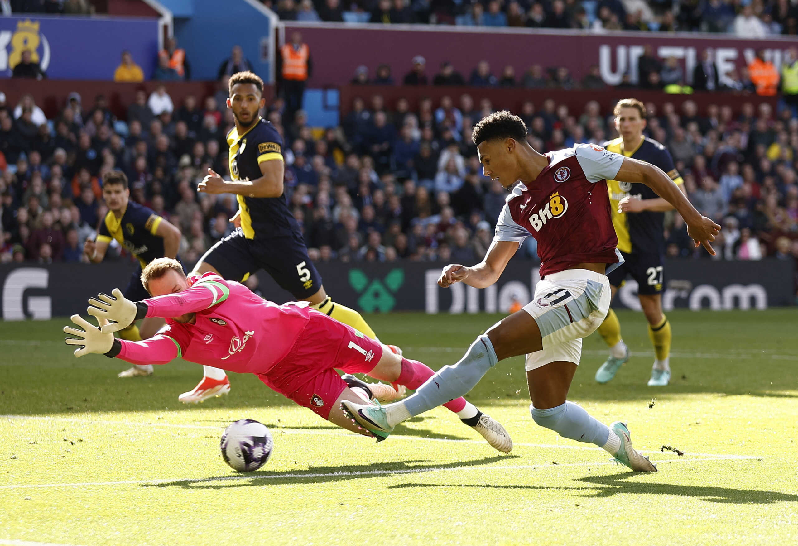 Soccer Football - Premier League - Aston Villa v AFC Bournemouth - Villa Park, Birmingham, Britain - April 21, 2024 Aston Villa's Ollie Watkins in action with AFC Bournemouth's Neto before Aston Villa's Leon Bailey scores their third goal Action Images via Reuters