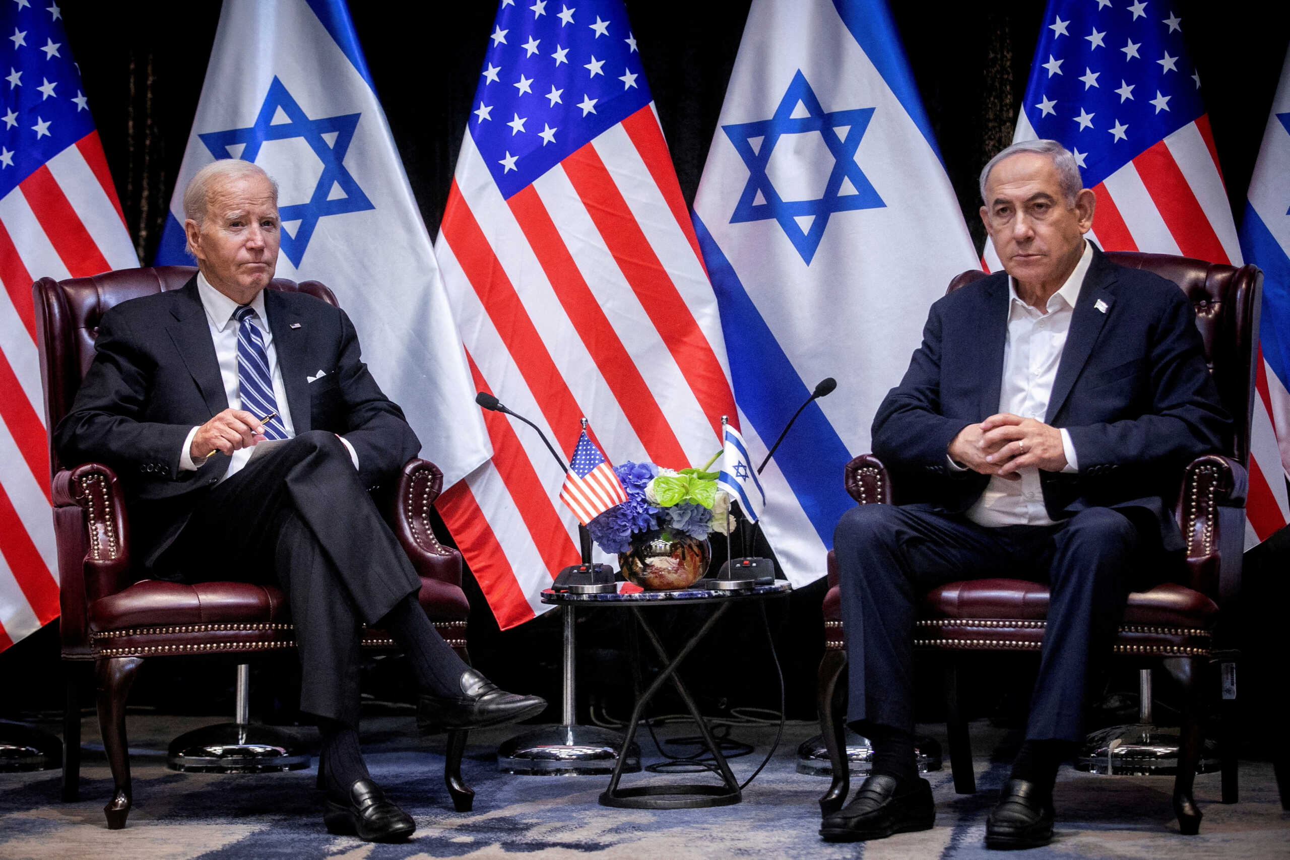 FILE PHOTO: U.S. President Joe Biden, left, pauses during a meeting with Israeli Prime Minister Benjamin Netanyahu, right, to discuss the war between Israel and Hamas, in Tel Aviv, Israel, Wednesday, Oct. 18, 2023.  Miriam Alster