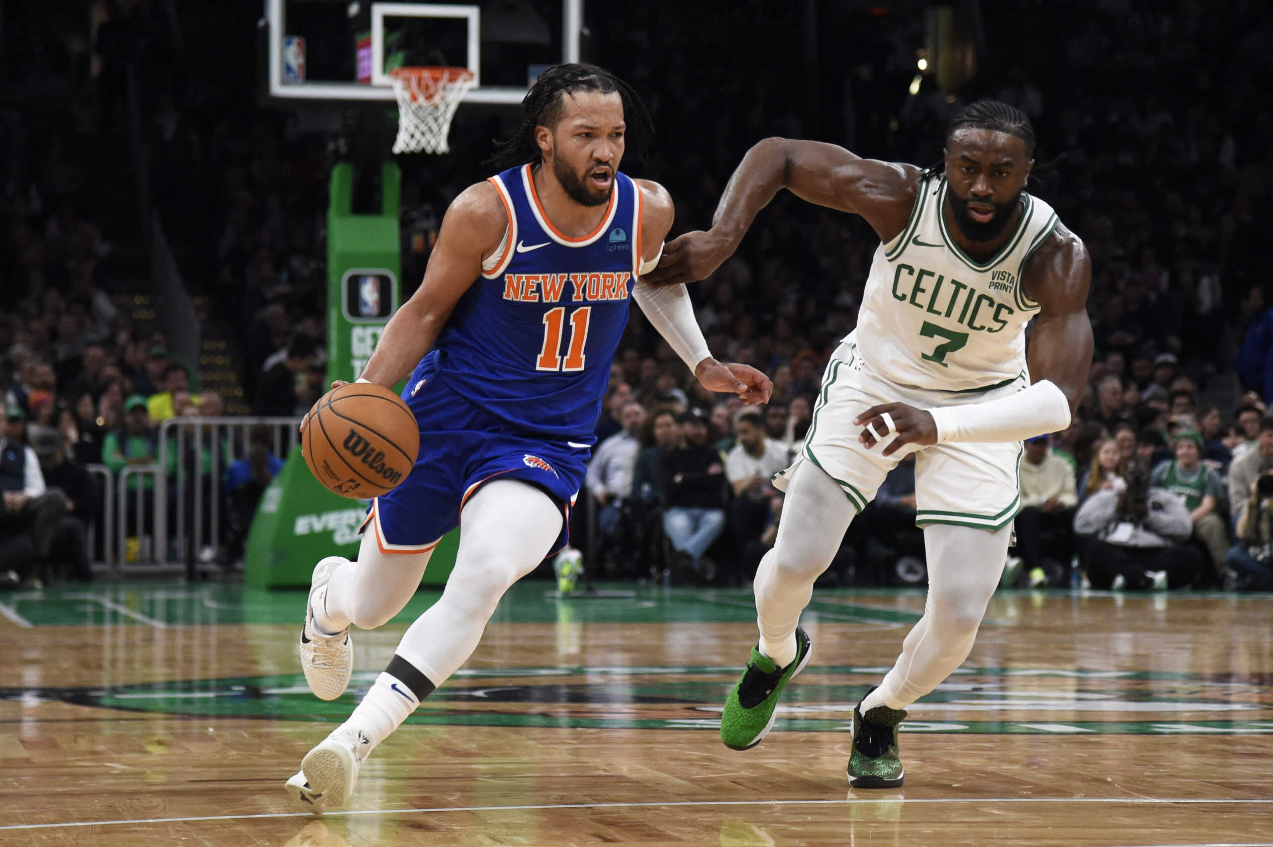 Apr 11, 2024; Boston, Massachusetts, USA;  New York Knicks guard Jalen Brunson (11) controls the ball while Boston Celtics guard Jaylen Brown (7) defends during the first half at TD Garden. Mandatory Credit: Bob DeChiara-USA TODAY Sports