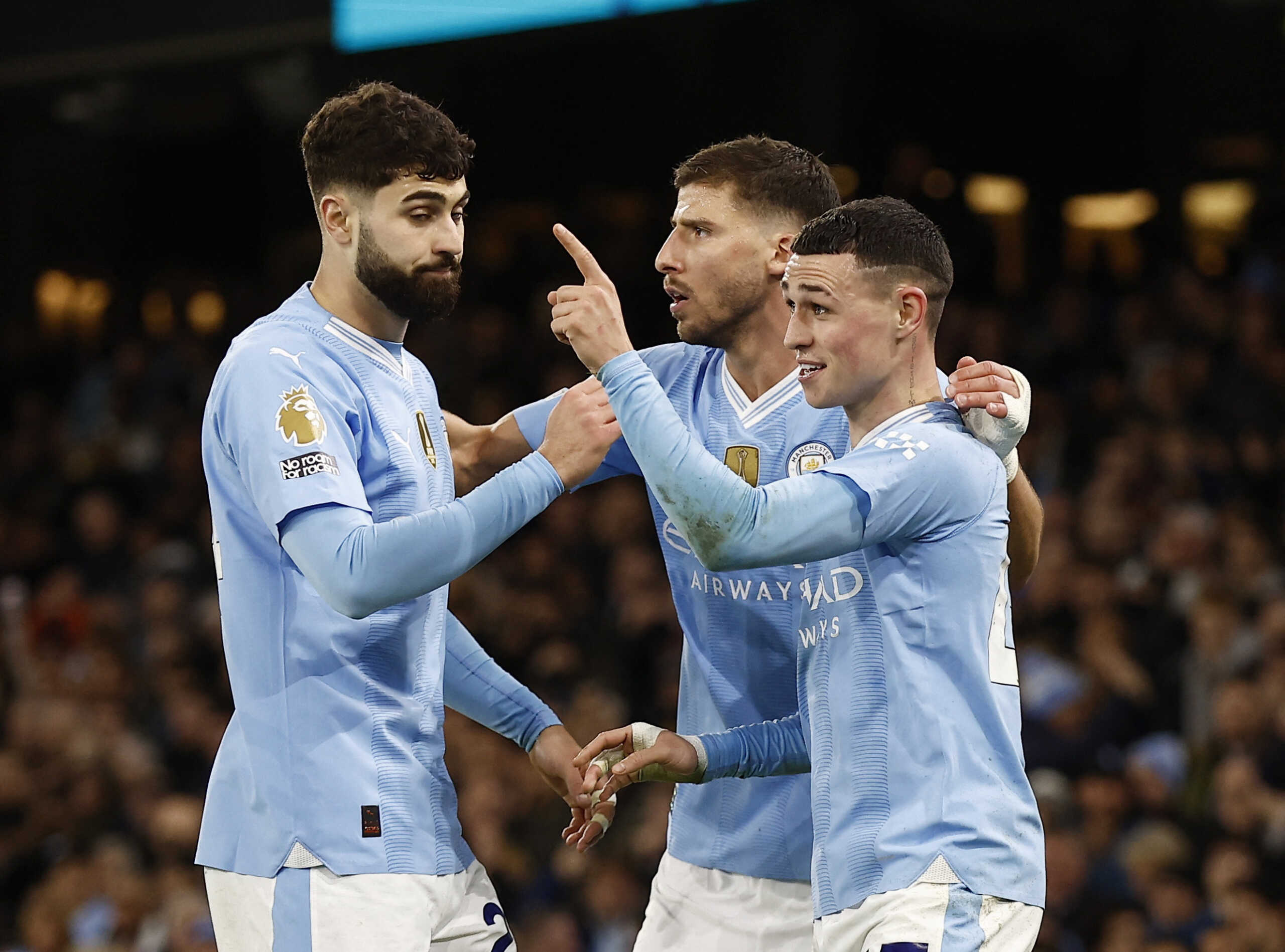 Soccer Football - Premier League - Manchester City v Aston Villa - Etihad Stadium, Manchester, Britain - April 3, 2024 Manchester City's Phil Foden celebrates scoring their third goal with Josko Gvardiol and Ruben Dias Action Images via Reuters