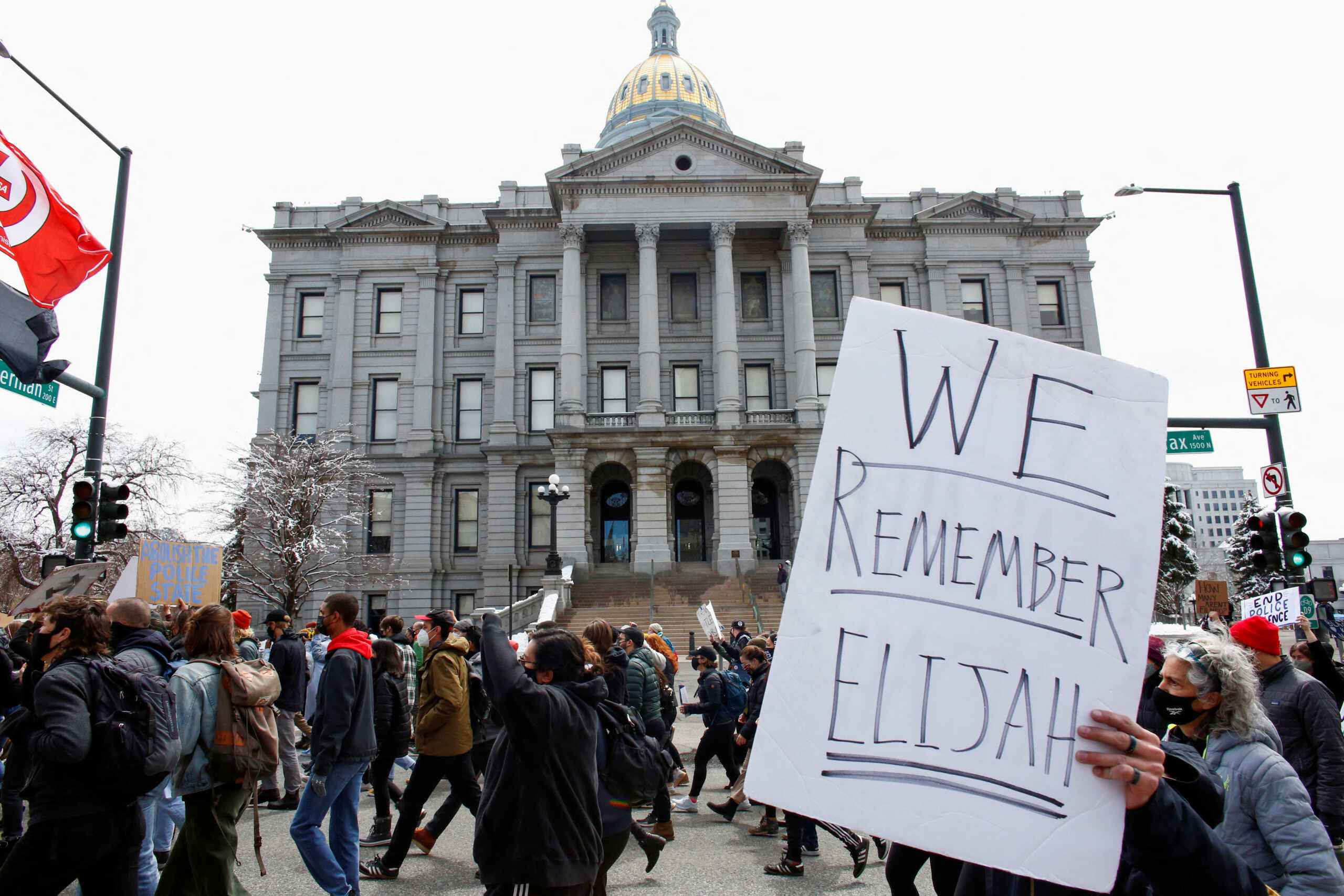 FILE PHOTO: A sign stating "We Remember Elijah" referencing Elijah McClain, is raised during a protest against the Brooklyn Center, Minnesota, police shooting of Daunte Wright, in Denver, Colorado, U.S., April 17, 2021.  REUTERS