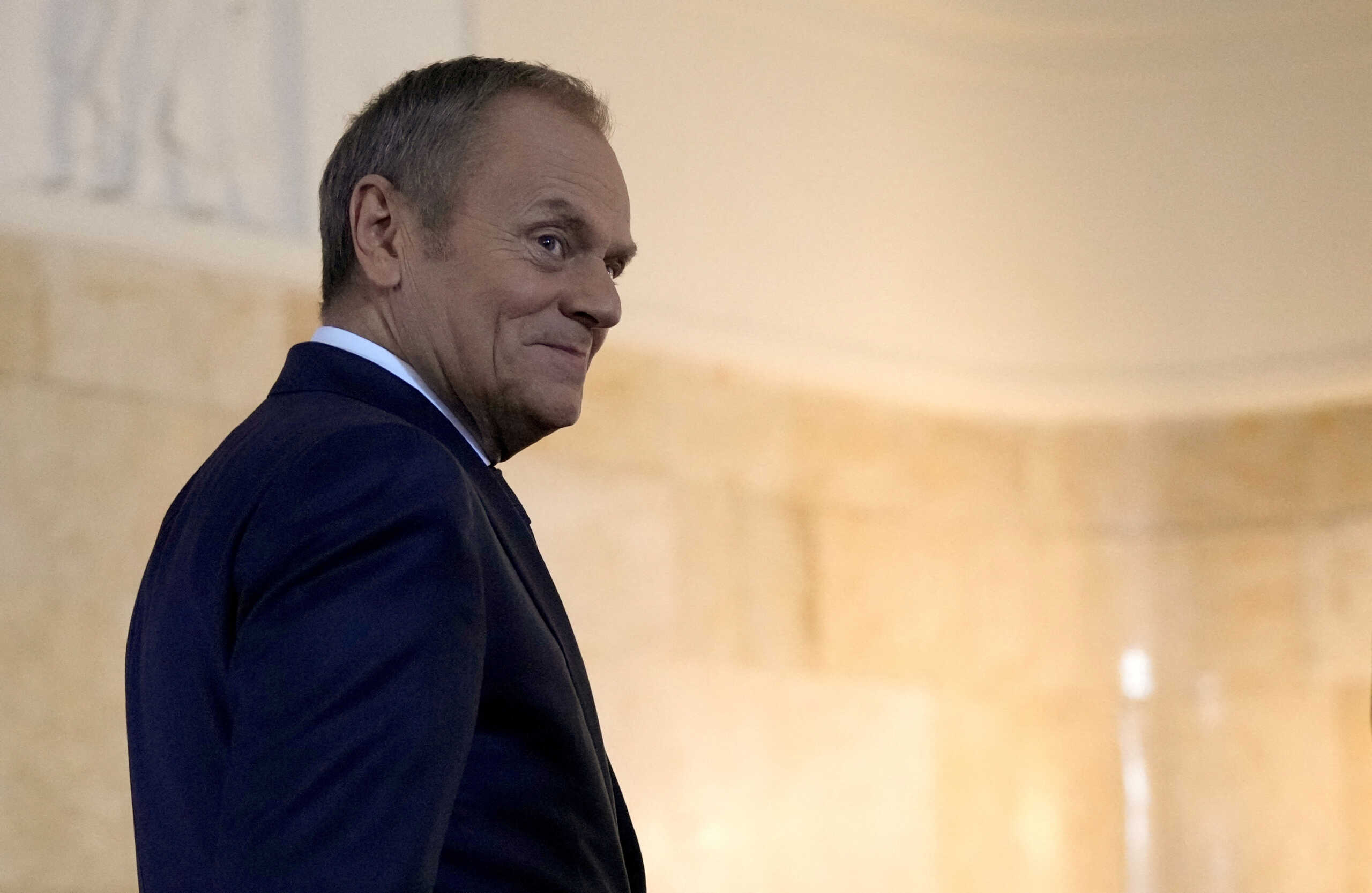 FILE PHOTO: Polish Prime Minister Donald Tusk walks to meet British Prime Minister Rishi Sunak at the Chancellery of the Prime Minister in Warsaw, Poland, April, 23, 2024. REUTERS