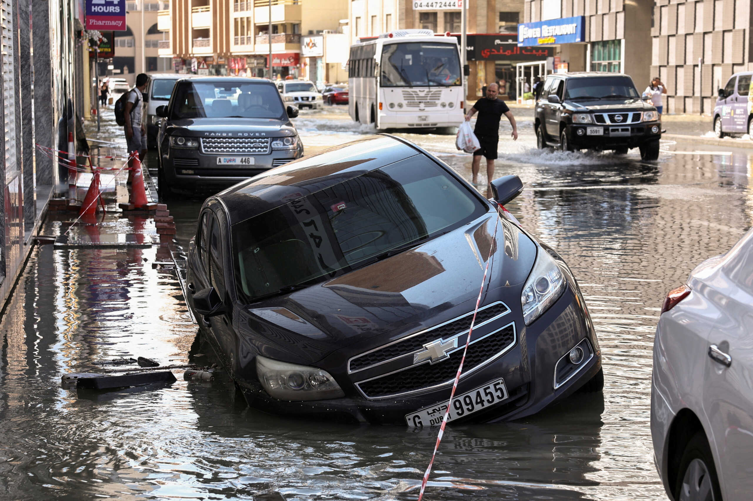 A car is stranded in flood water caused by heavy rains, in Dubai, United Arab Emirates, April 17, 2024. REUTERS