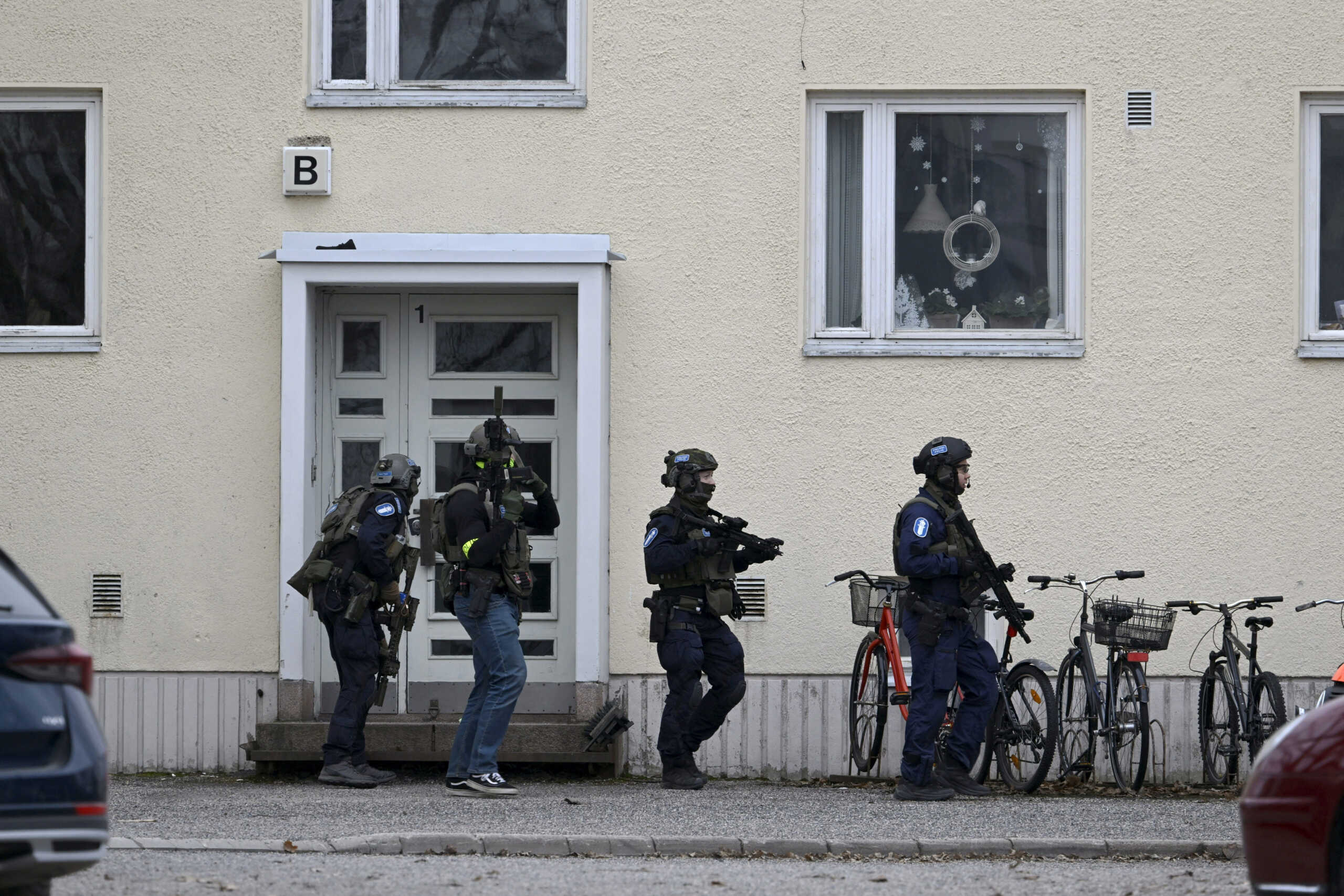 Police officers operate at the Viertola comprehensive school in Vantaa, Finland, on April 2, 2024. Three minors were injured in a shooting at the school on Tuesday morning. A suspect, also a minor, has been apprehended.   Lehtikuva