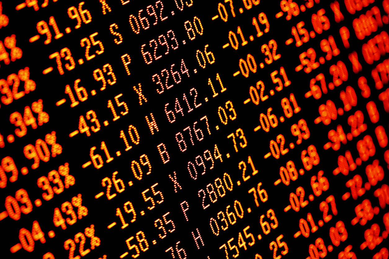 Trading screen financial data in red. Sell-off. Selective focus. Focus is appx central. Heavy selling.