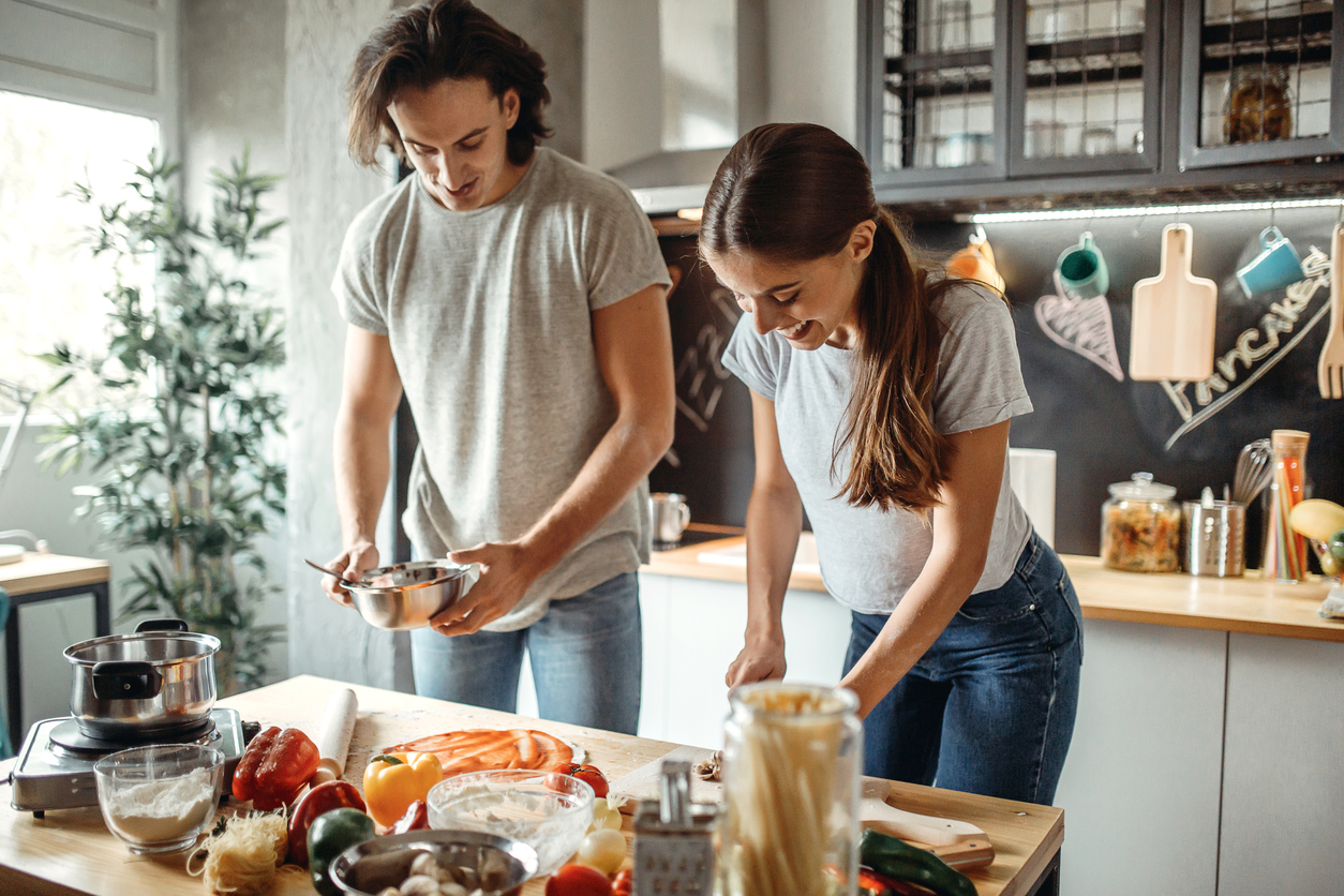 Couple preparing pizza